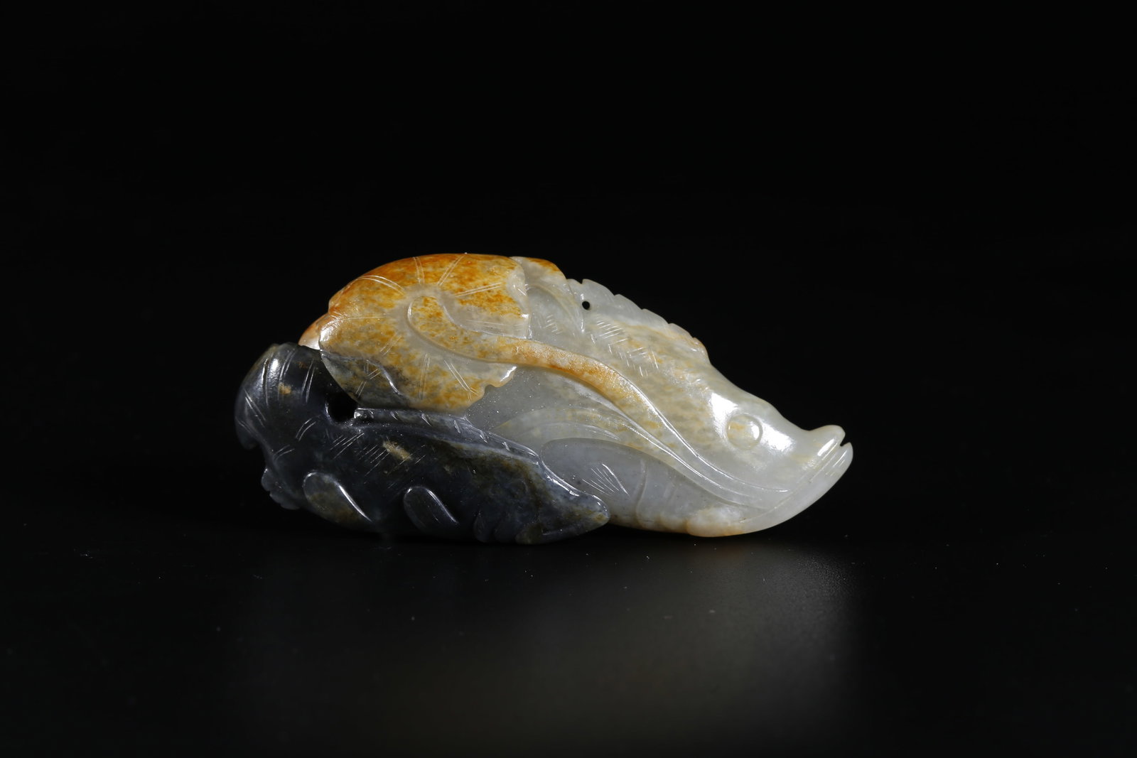 A HETIAN JADE CARVED FISH ORNAMENT (1 of 10)