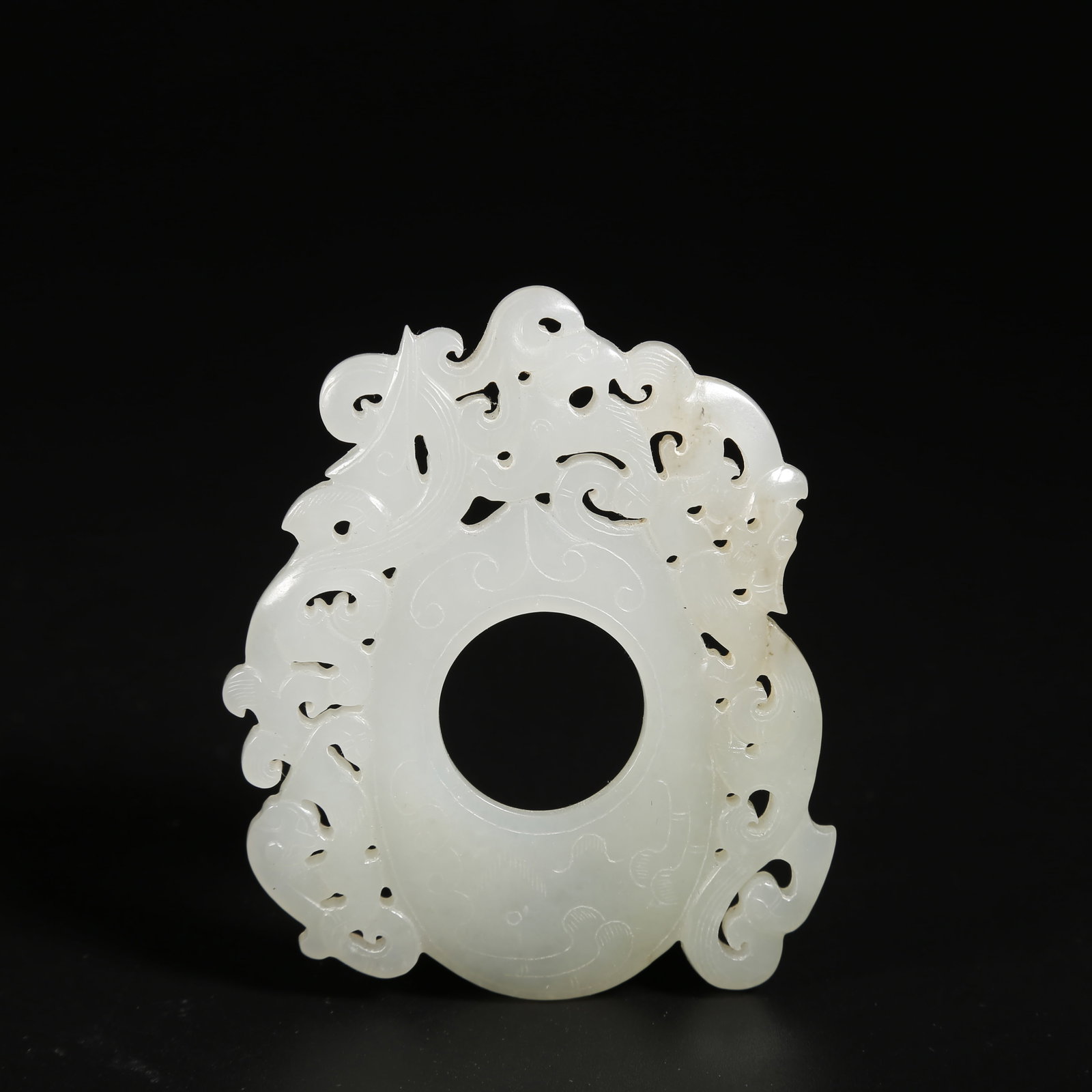 A HETIAN JADE CHICKEN-HEART PENDANT (1 of 9)