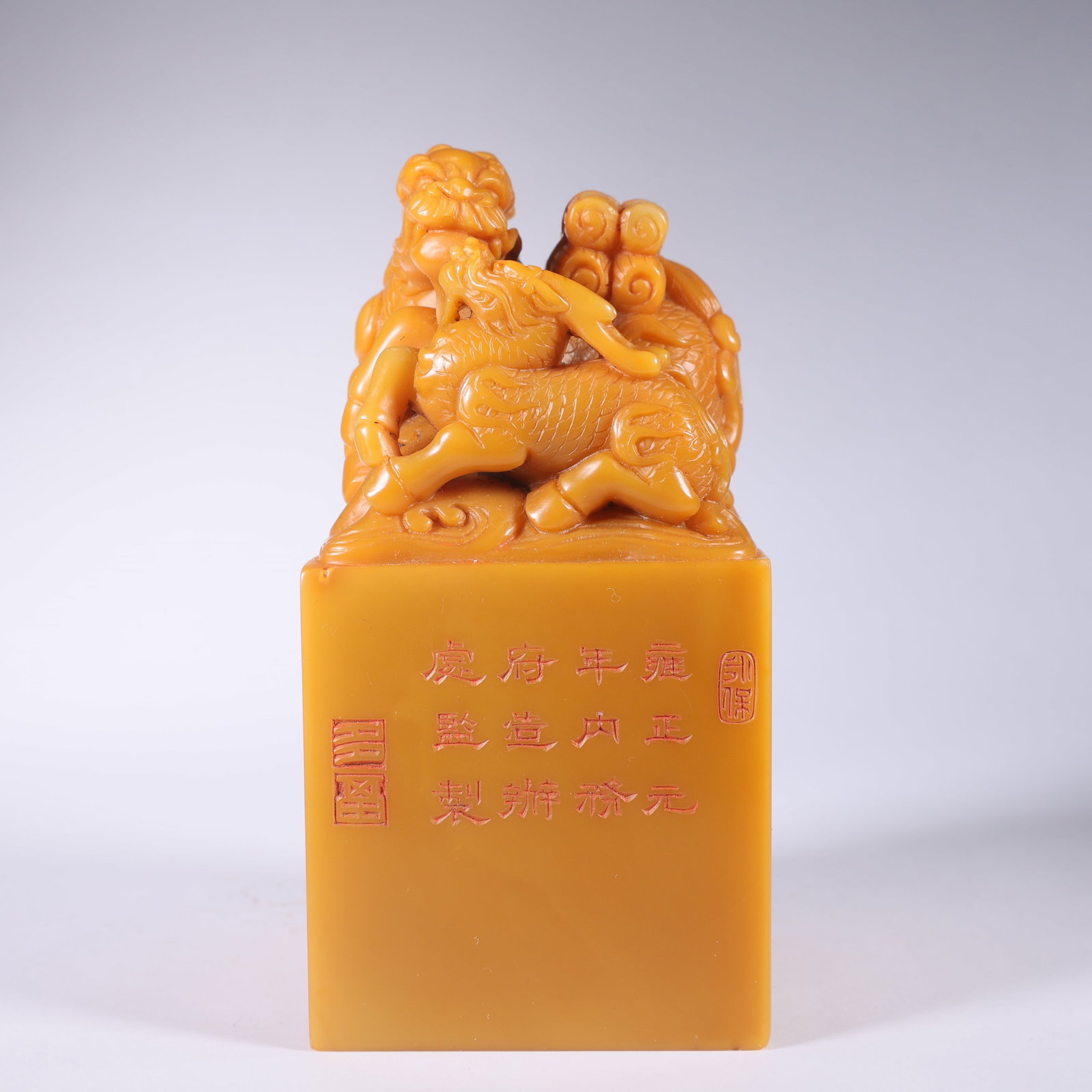 A TIANHUANG STONE SEAL WITH MOTHER-AND-CHILD QILIN HOLDING BOOK (1 of 9)