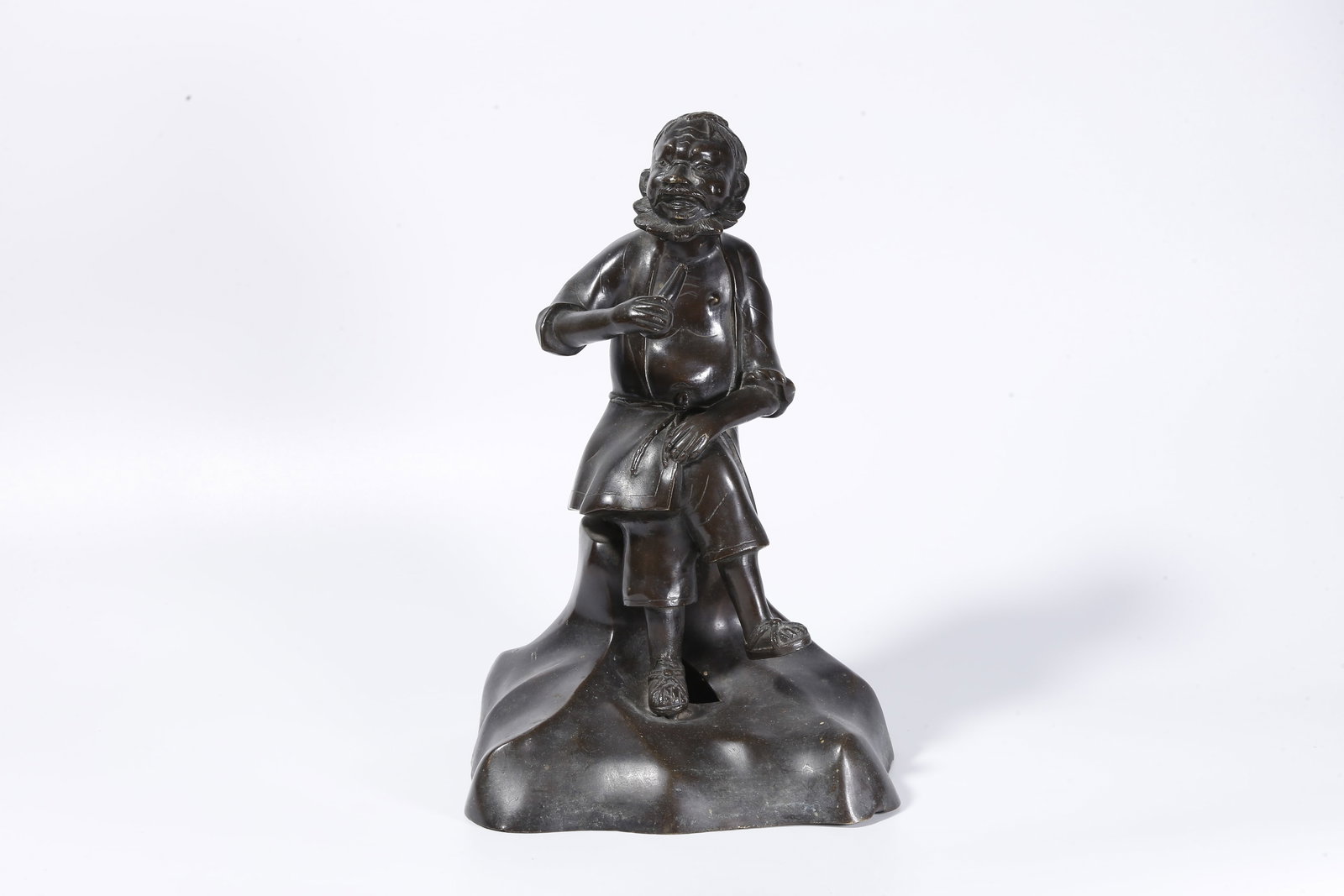 A BRONZE ARHAT FIGURE (EMACIATED FORM): Bronze Arhat Figure (Emaciated Form)