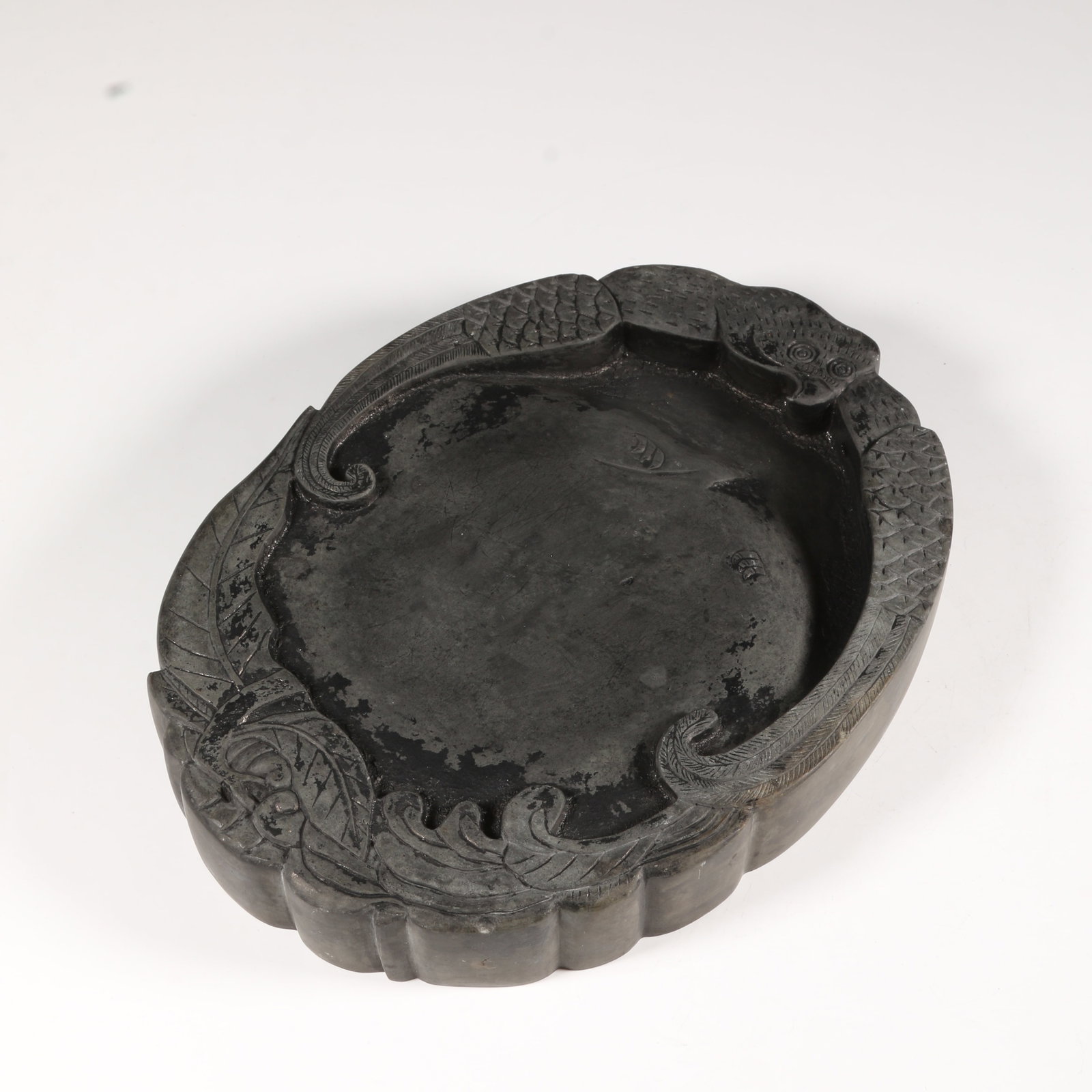 A DUANSHI STONE INKSTONE WITH BEAST MOTIF (1 of 12)