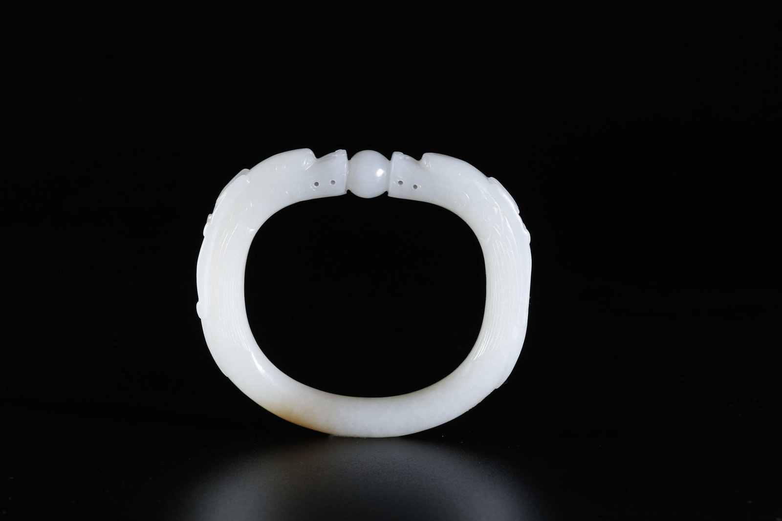 A HETIAN JADE CARVED BRACELET WITH DRAGON MOTIF (1 of 9)