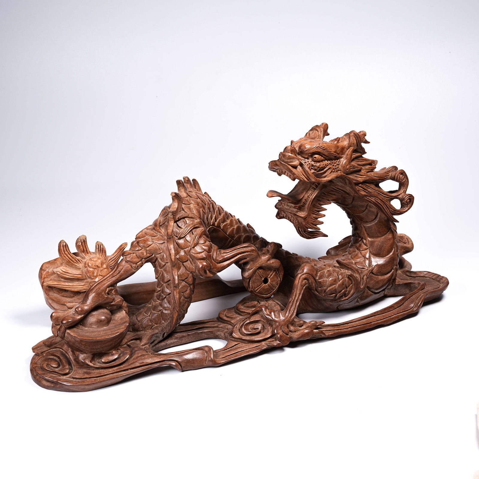 A BOXWOOD CLOUD-AND-DRAGON PAPERWEIGHT: Boxwood cloud-and-dragon paperweight