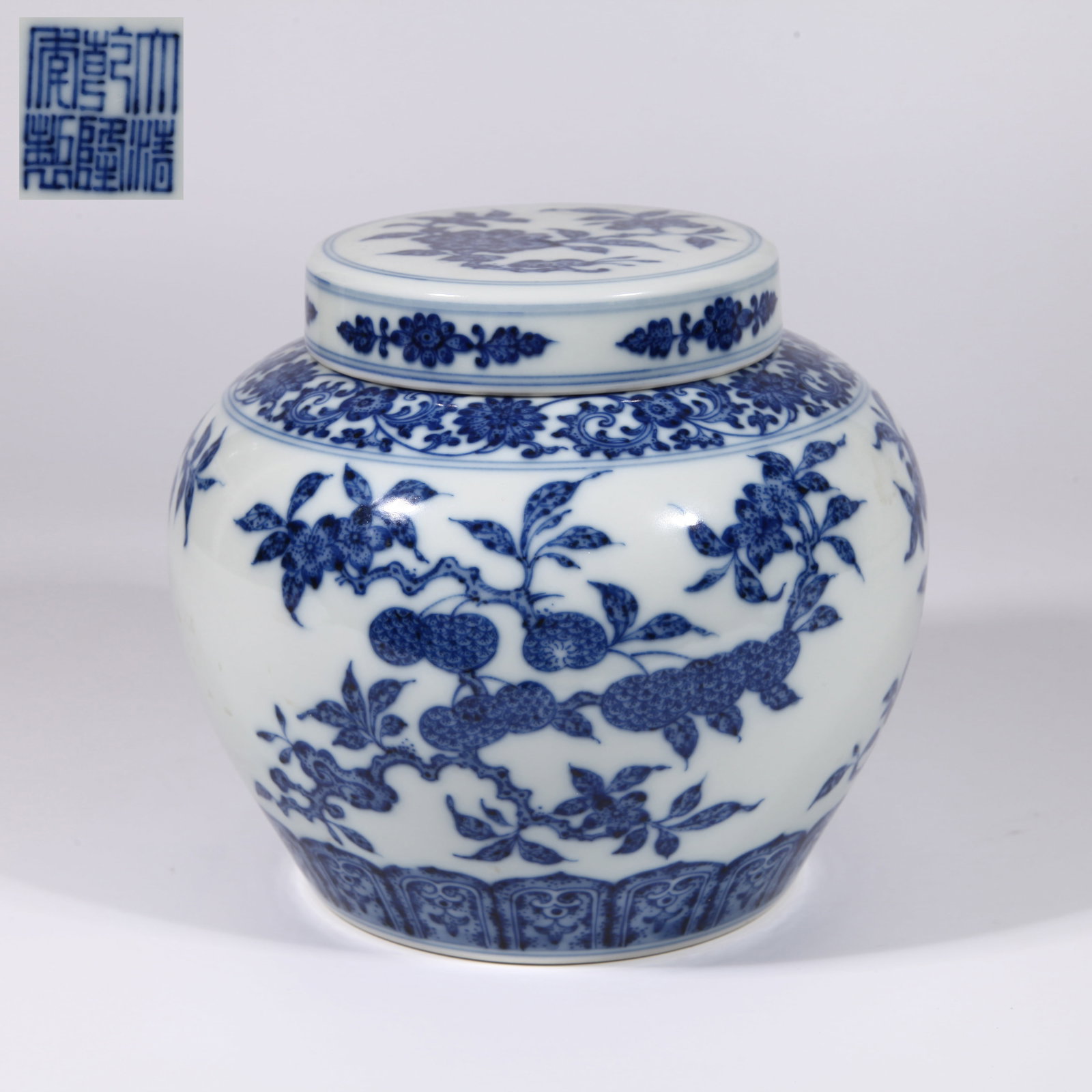 A COVERED JAR WITH BRANCHING FLOWERS AND FRUITS IN UNDERGLAZE BLUE (1 of 10)
