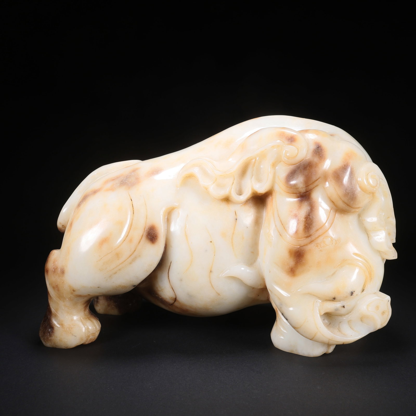 A HETIAN JADE "PEACEFUL ELEPHANT" ORNAMENT: Hetian Jade "Peaceful Elephant" Ornament