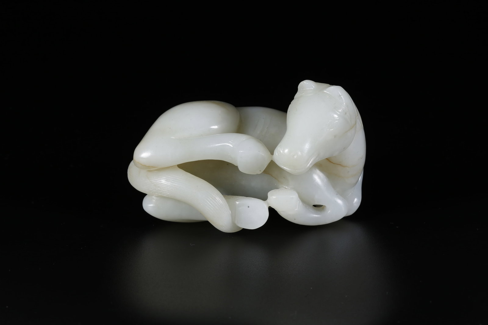 A HETIAN JADE CARVED HORSE-SHAPED ORNAMENT (1 of 9)