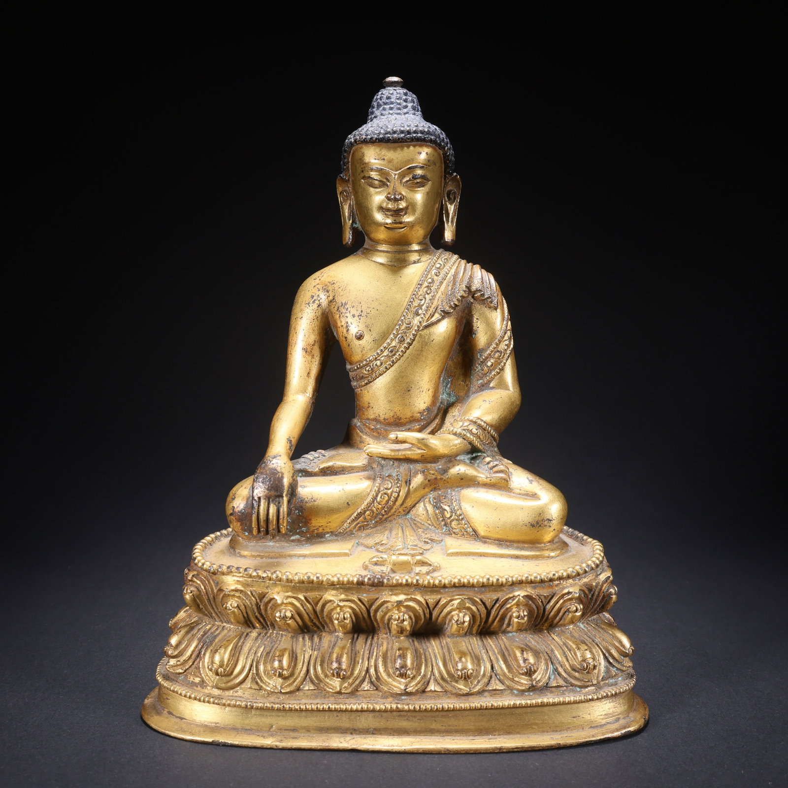 A GILT BRONZE SHAKYAMUNI (1 of 9)
