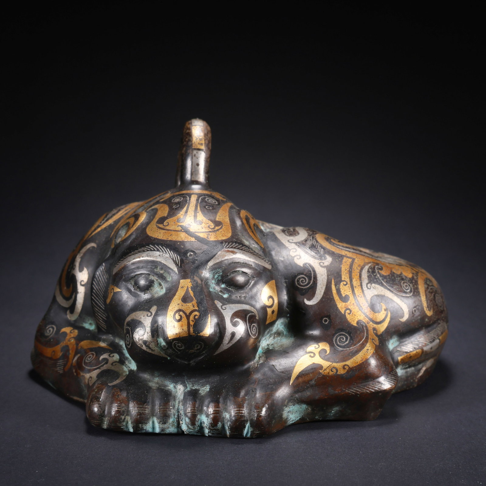 A BRONZE BEAST WITH HOOKED HEAD INLAID WITH GOLD AND SILVER: Bronze Beast with Hooked Head Inlaid with Gold and Silver