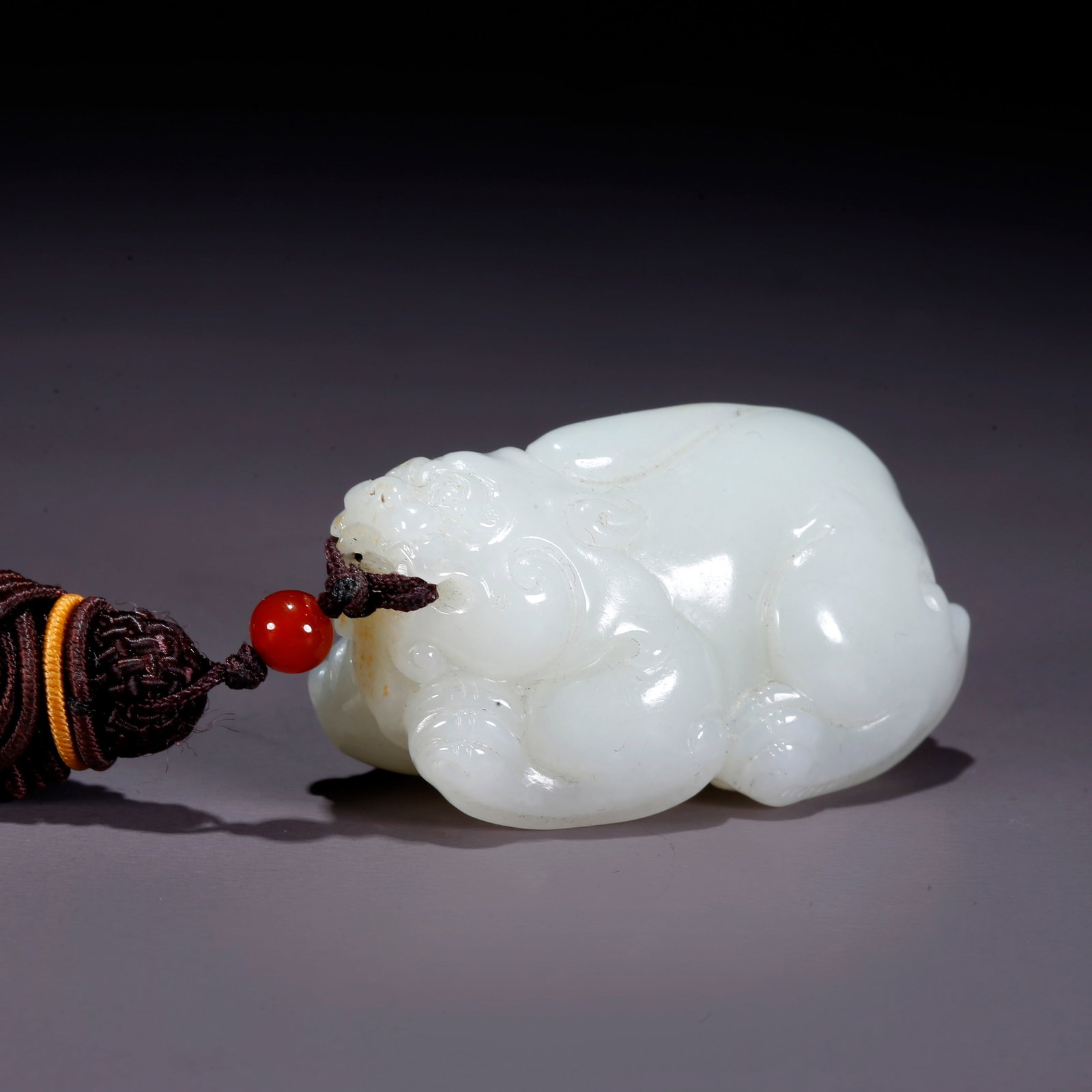 A HETIAN JADE CARVED BEAST-SHAPED HANDLE (1 of 8)