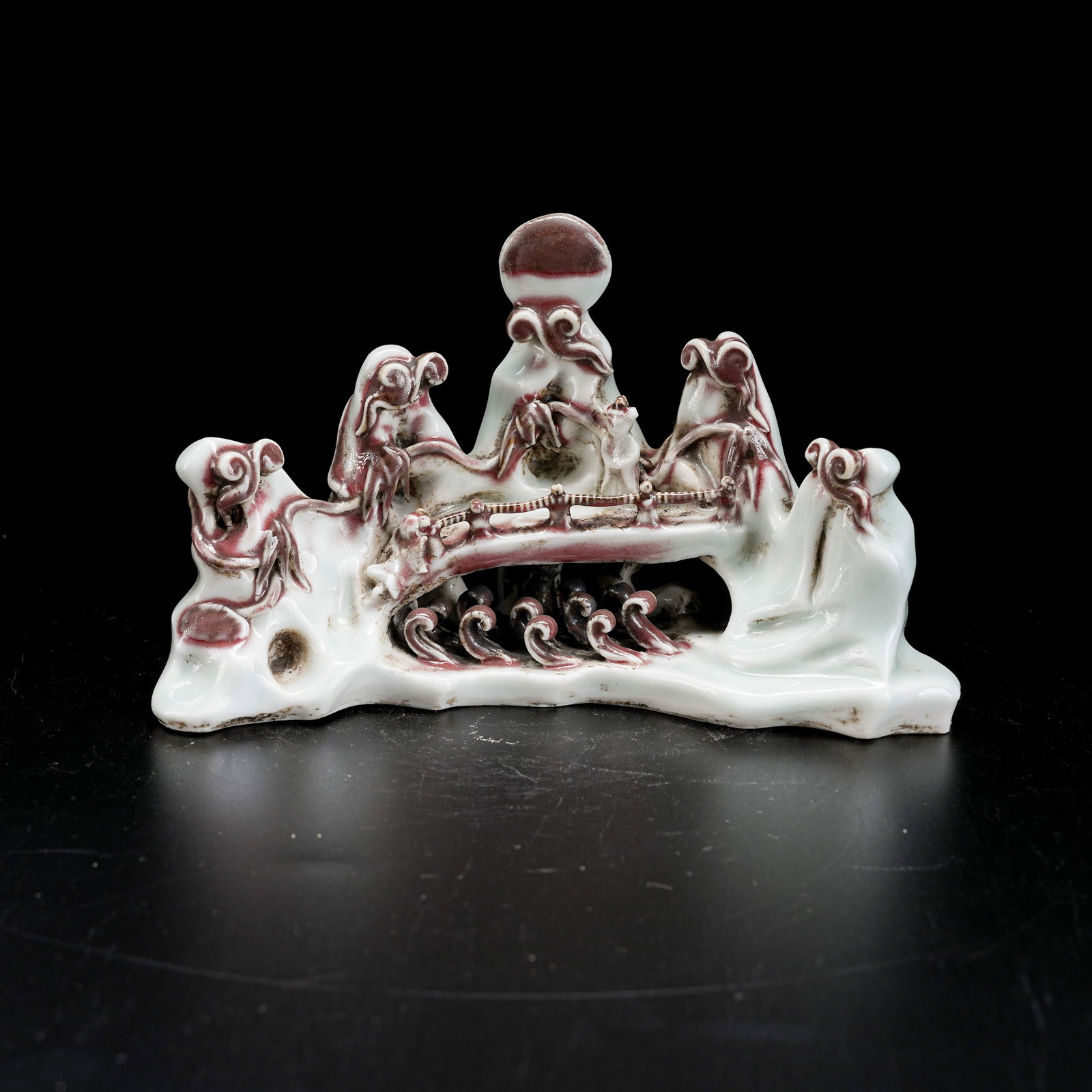 A CELADON BRUSH HOLDER WITH UNDERGLAZE RED MOUNTAIN MOTIF (1 of 8)