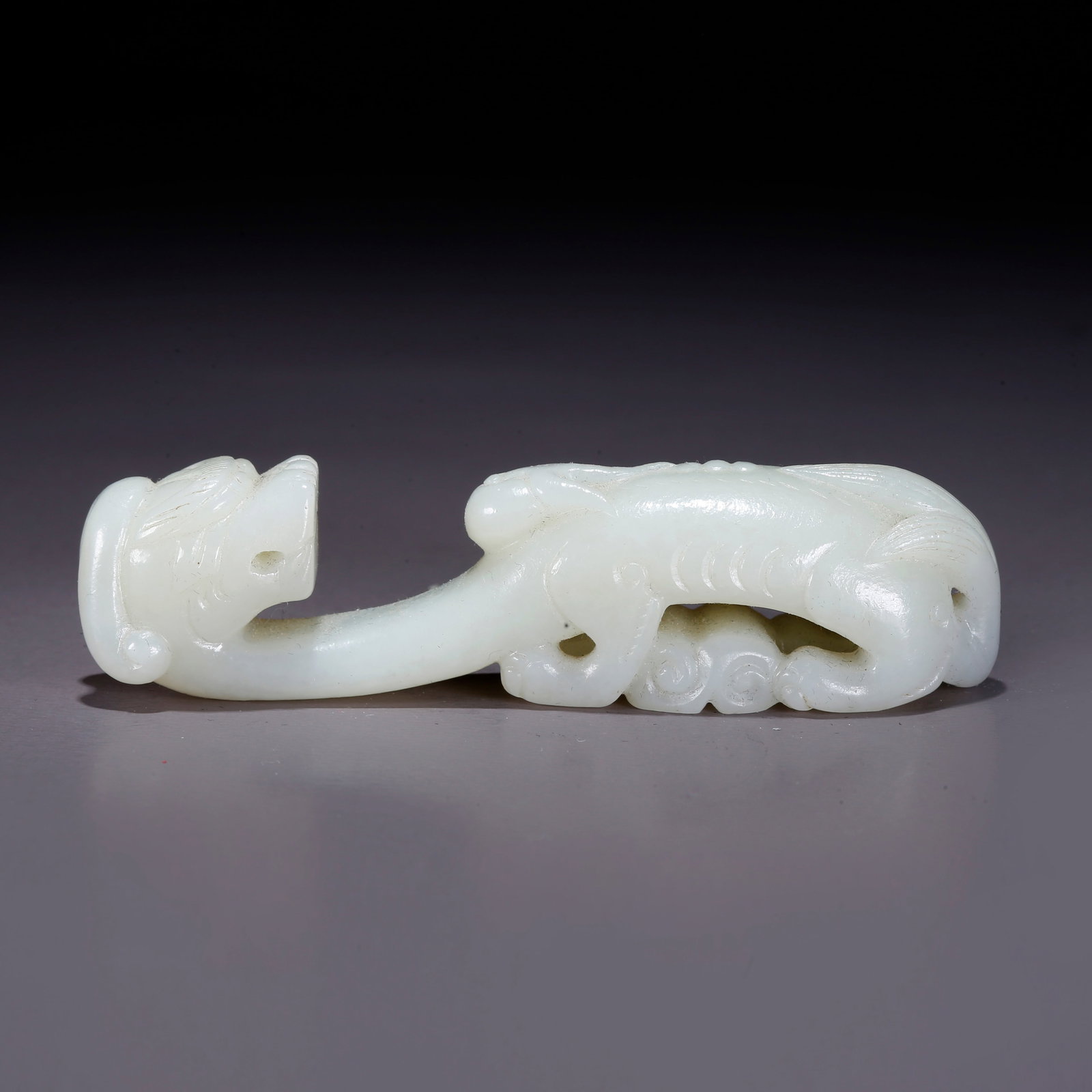 A HETIAN JADE CARVED DRAGON BELT HOOK (1 of 9)