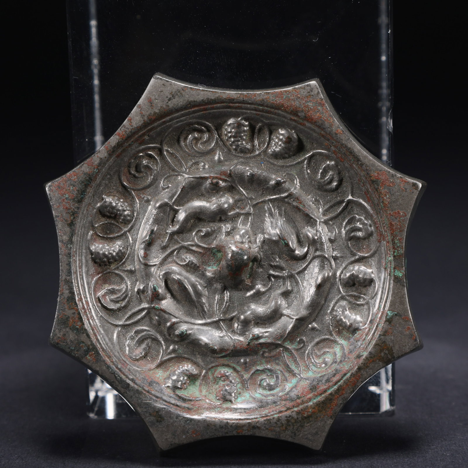 A BRONZE OCTAGONAL MIRROR WITH SEA BEAST MOTIF (1 of 9)