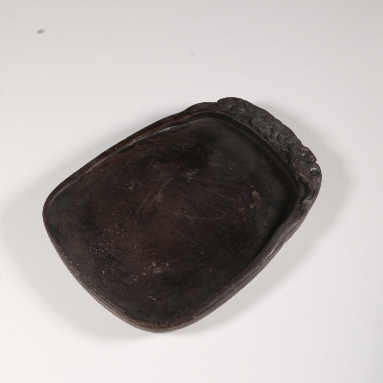 A DUANSHI STONE INKSTONE WITH AUSPICIOUS CLOUD MOTIF (1 of 9)