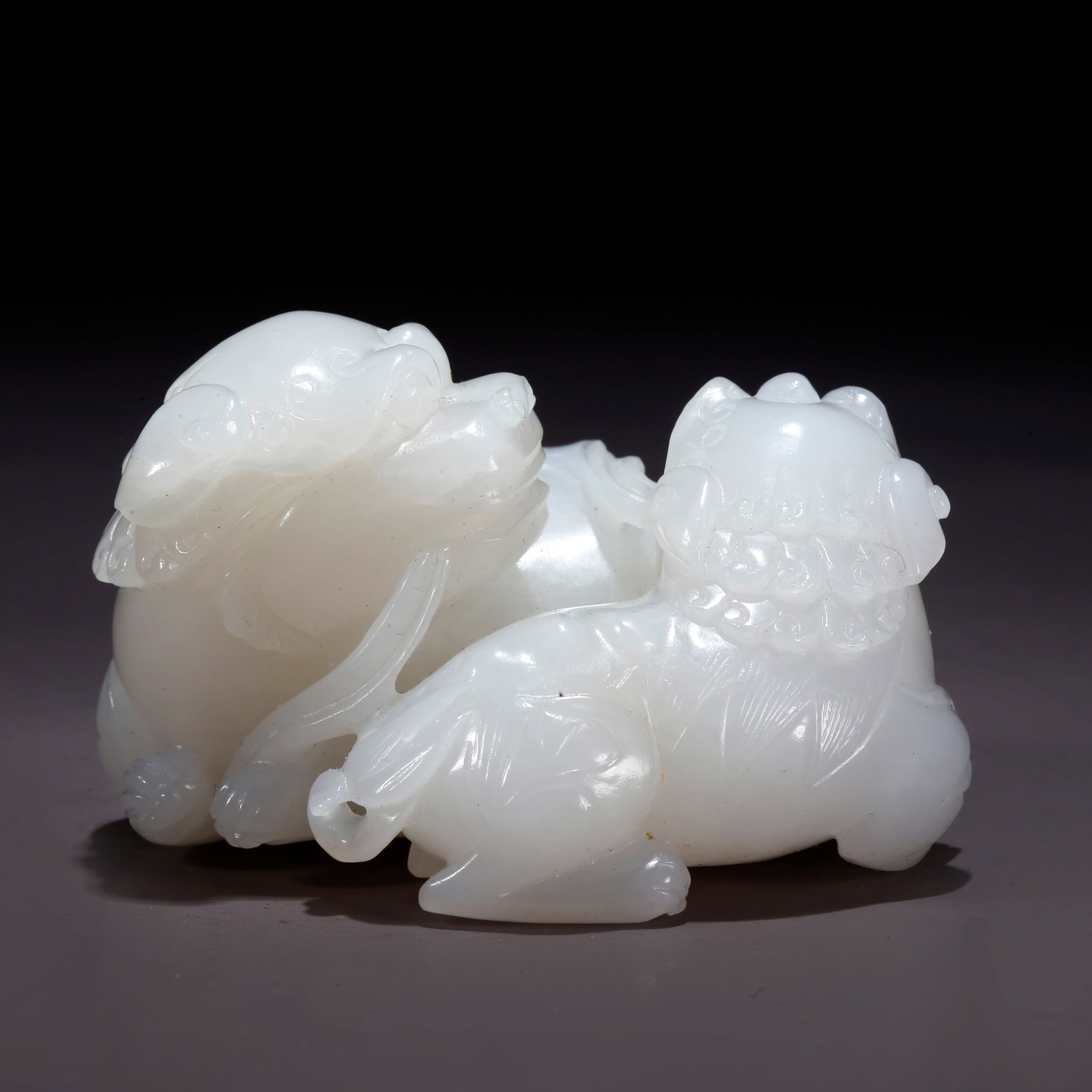A HETIAN JADE ADULT AND CUB LION FIGURINE (1 of 9)