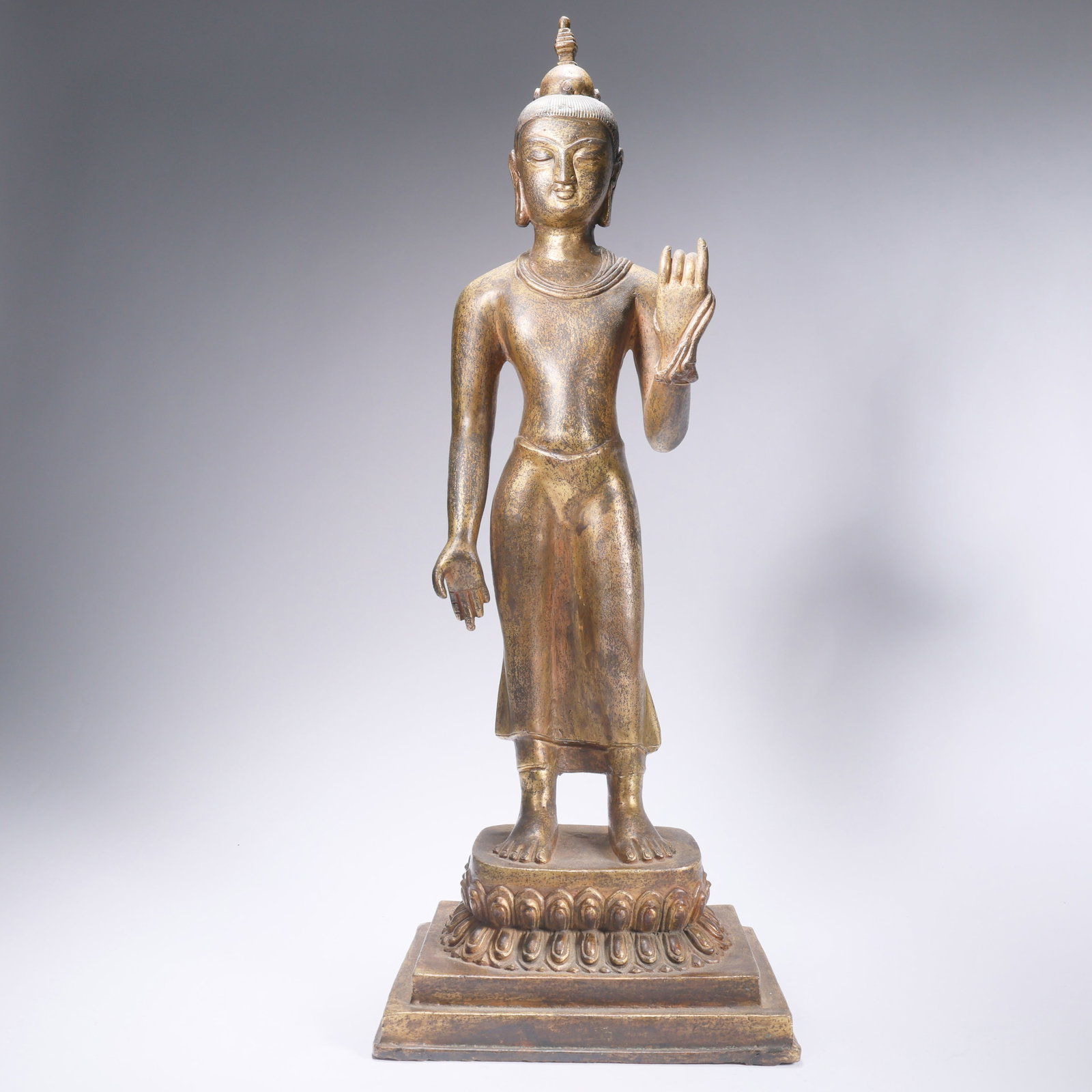 A GILT BRONZE STANDING SHAKYAMUNI (1 of 9)