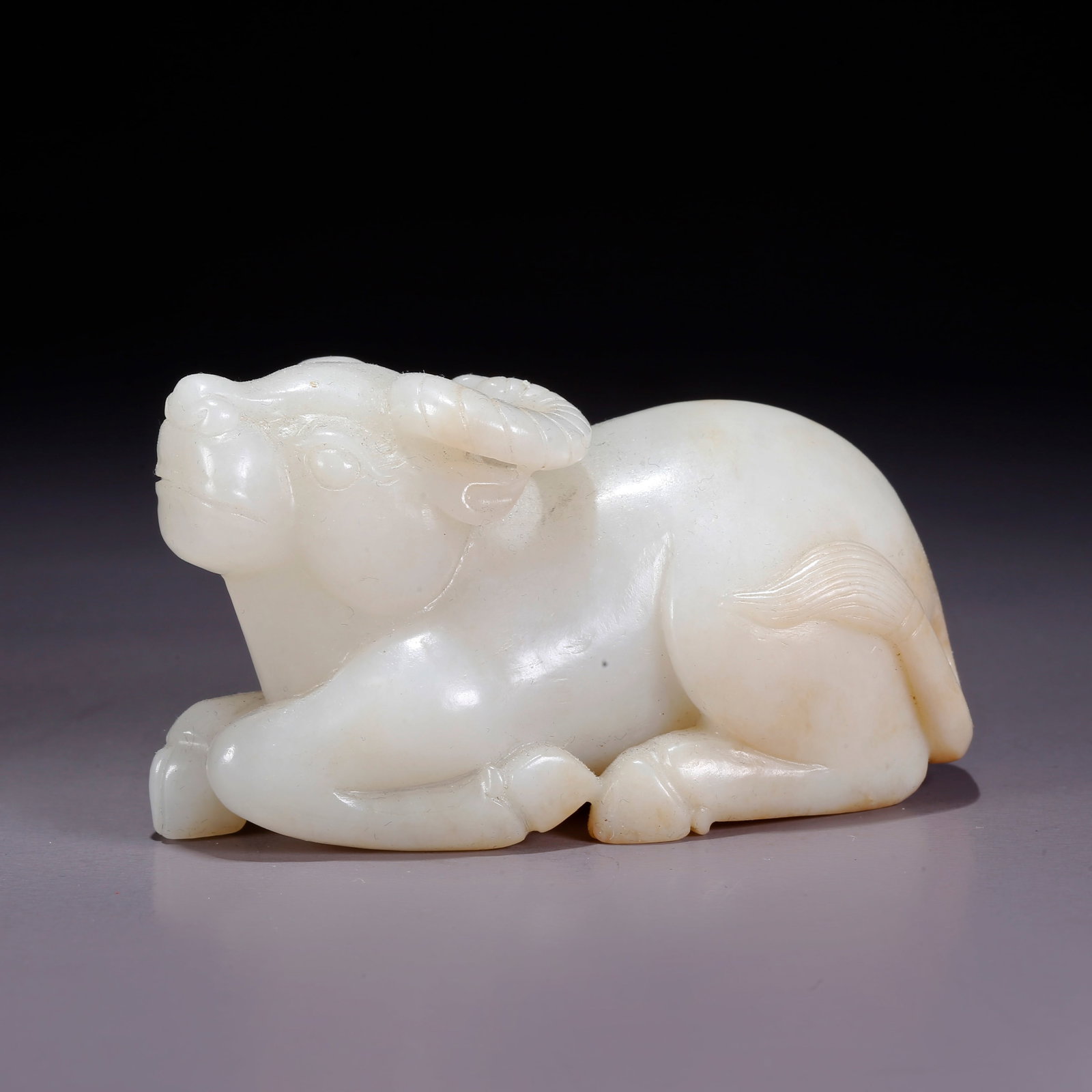 A HETIAN JADE CARVED OX ORNAMENT (1 of 9)