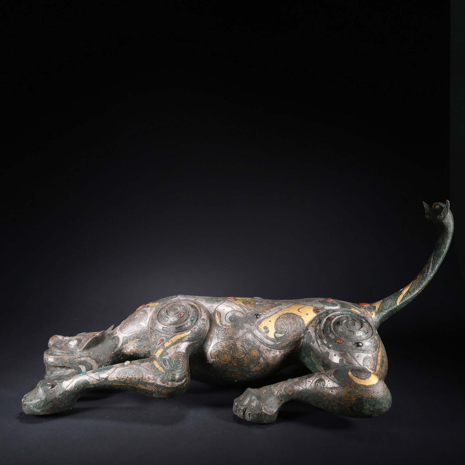 A BRONZE BEAST WITH CURLED TAIL INLAID WITH GOLD AND SILVER: Bronze Beast with Curled Tail Inlaid with Gold and Silver