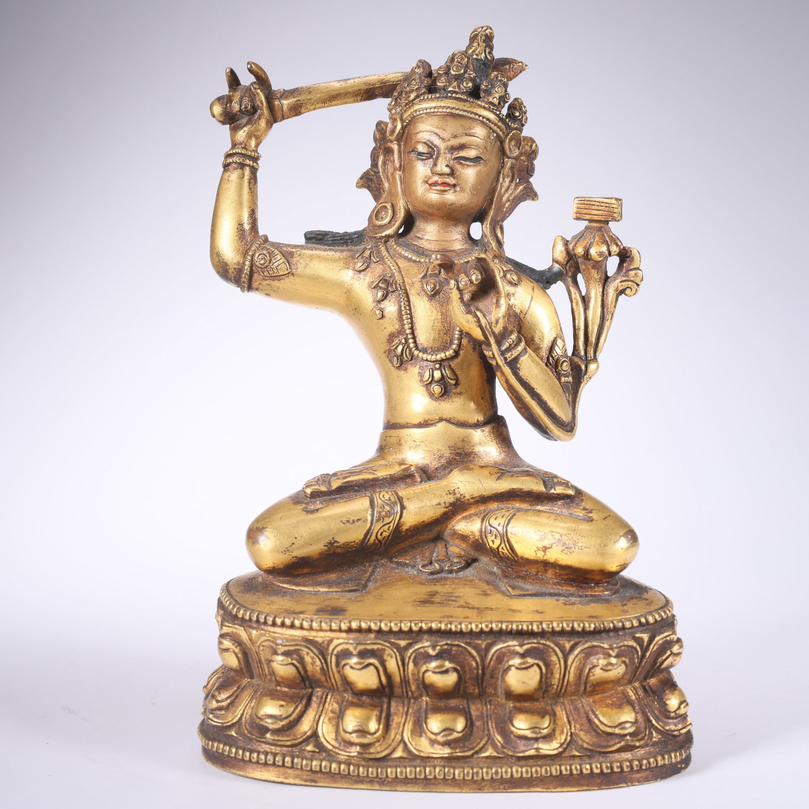 A GILT BRONZE MANJUSHRI: Gilt Bronze Manjushri