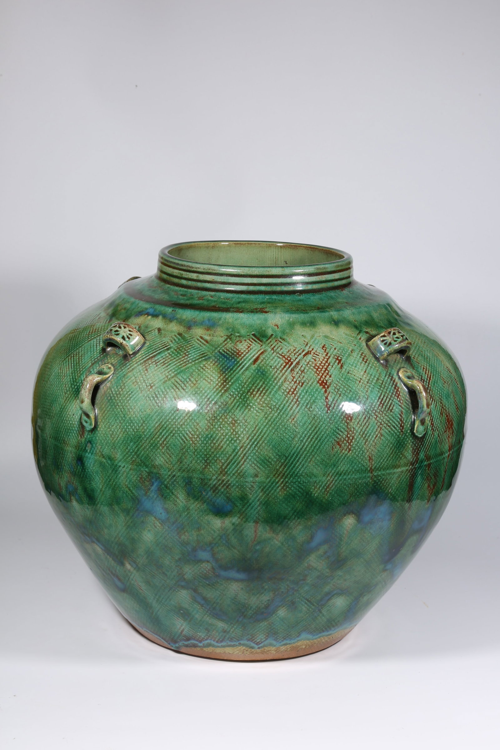 A GREEN-GLAZED FOUR-HANDLED JAR (1 of 9)