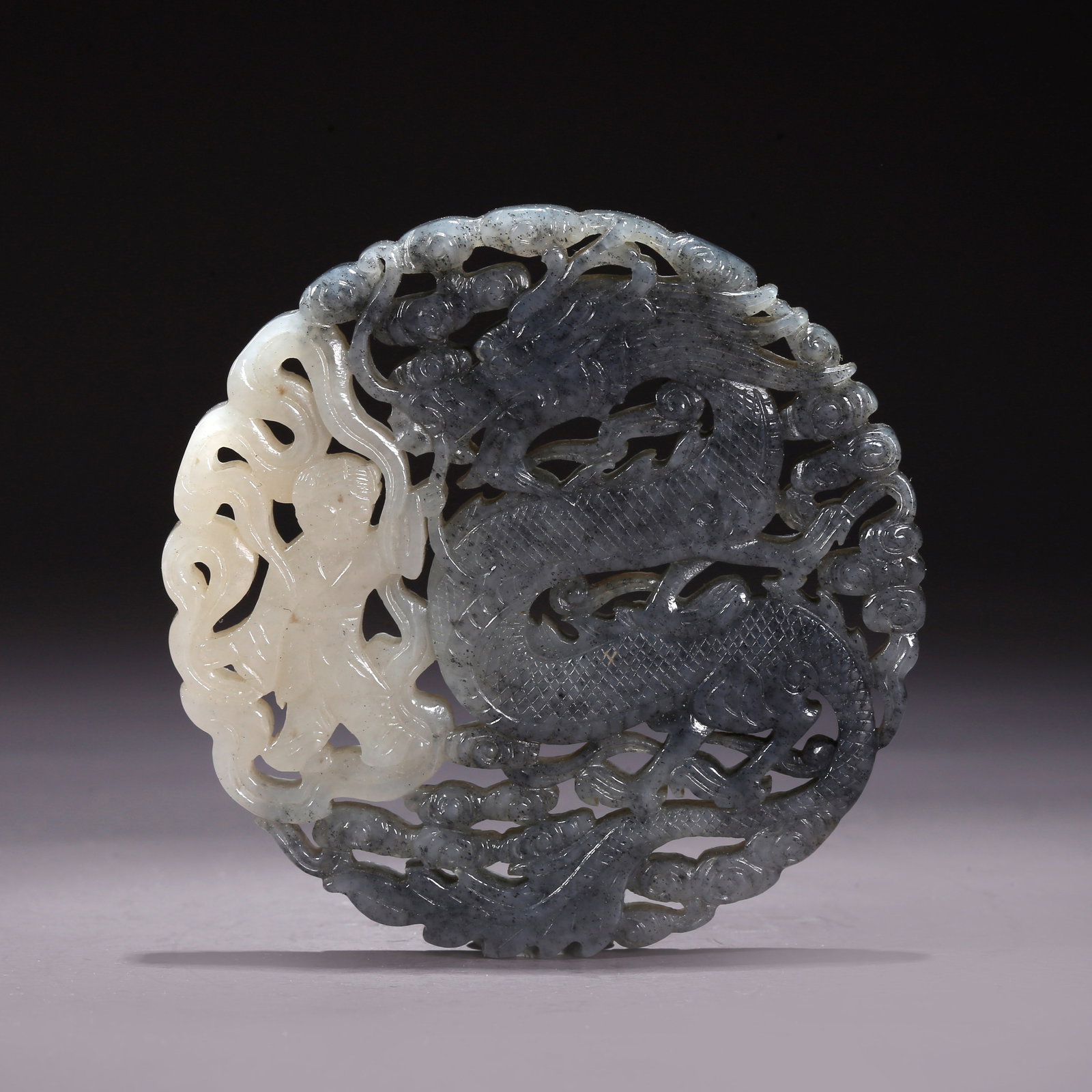 A HETIAN JADE SKILLFULLY CARVED DRAGON PENDANT (1 of 10)