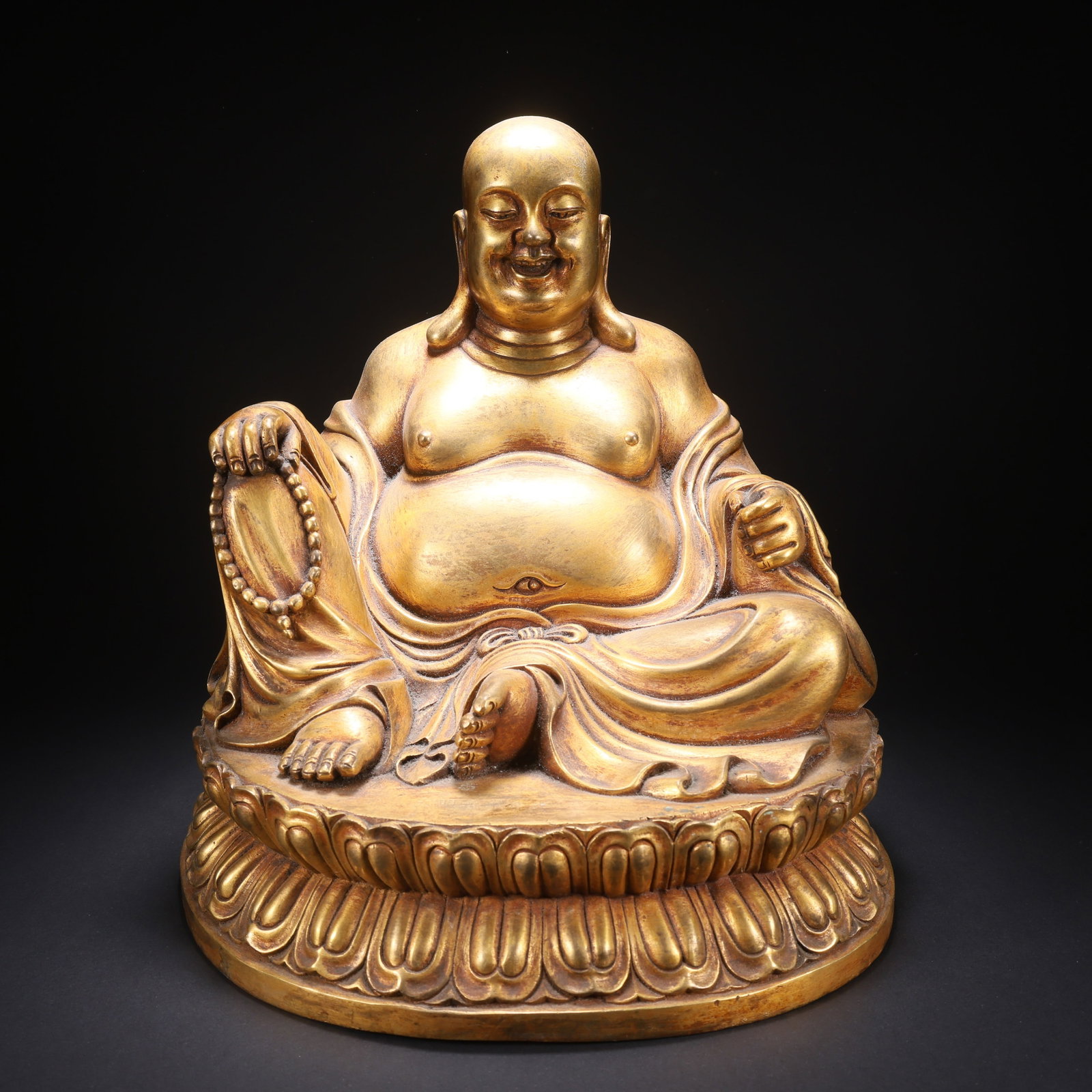 A GILT-COPPER BUDAI (LAUGHING MONK) FIGURE (1 of 9)