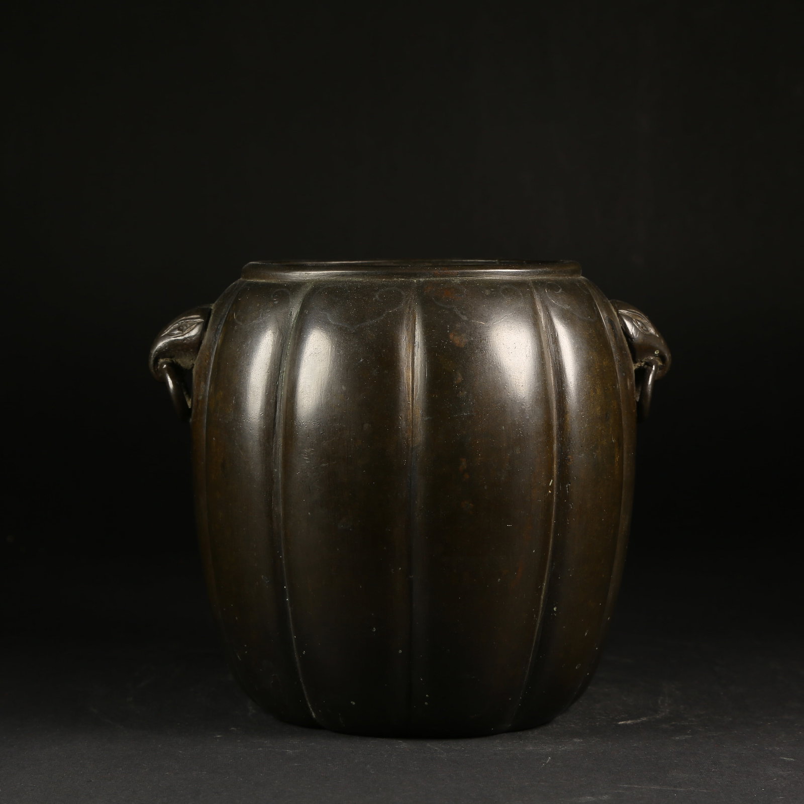 A BRONZE MELON-LOBED JAR WITH HANDLES (1 of 9)