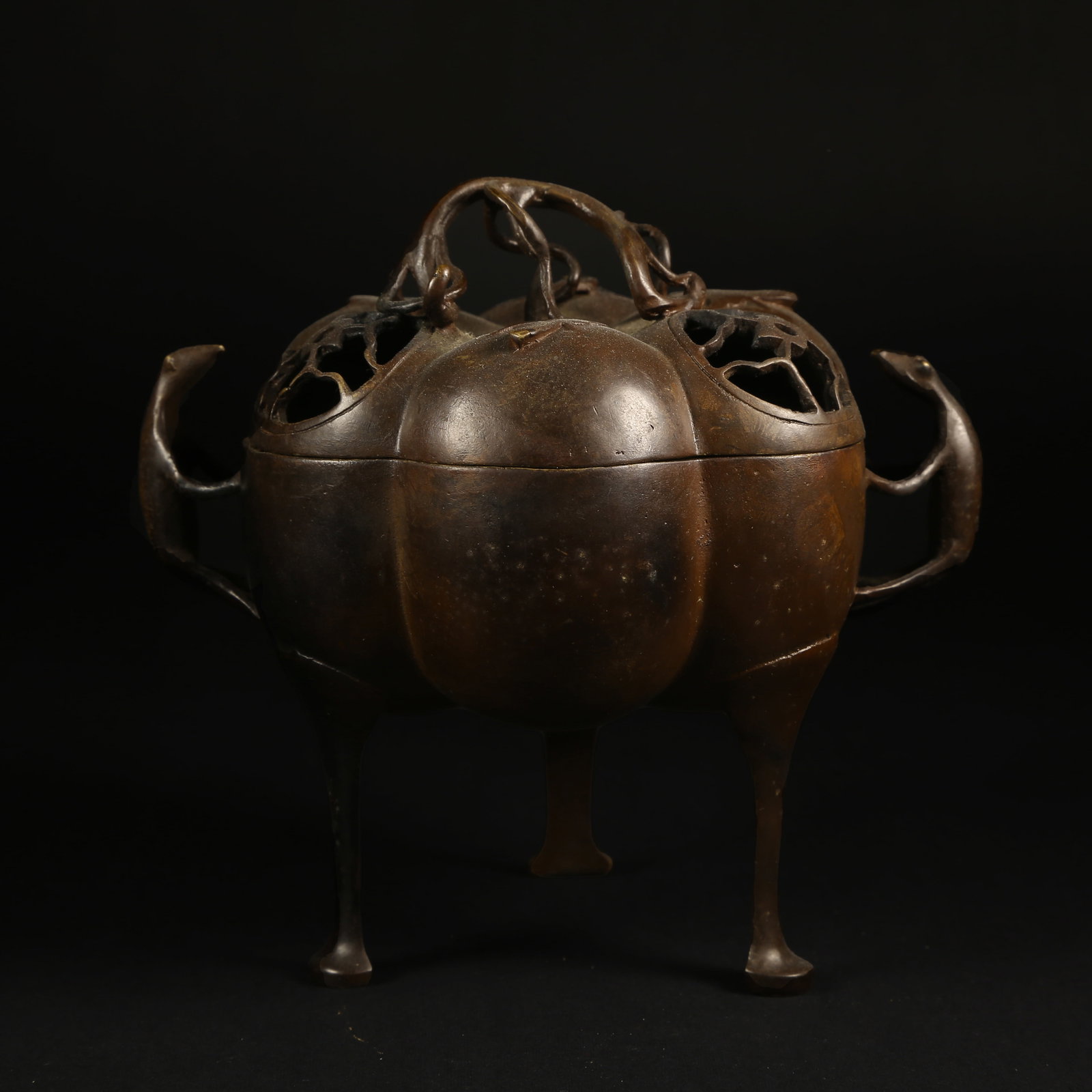 A BRONZE MELON-SHAPED THREE-LEGGED CENSER WITH BEAST HANDLES (1 of 10)