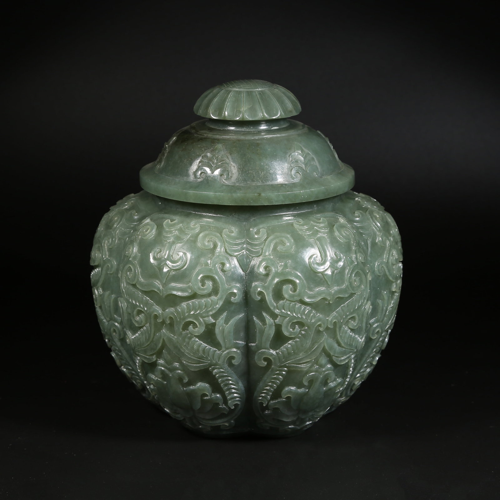 A HETIAN GREEN JADE MELON-RIBBED JAR WITH PRECIOUS-FIGURE FLOWER MOTIF (1 of 9)
