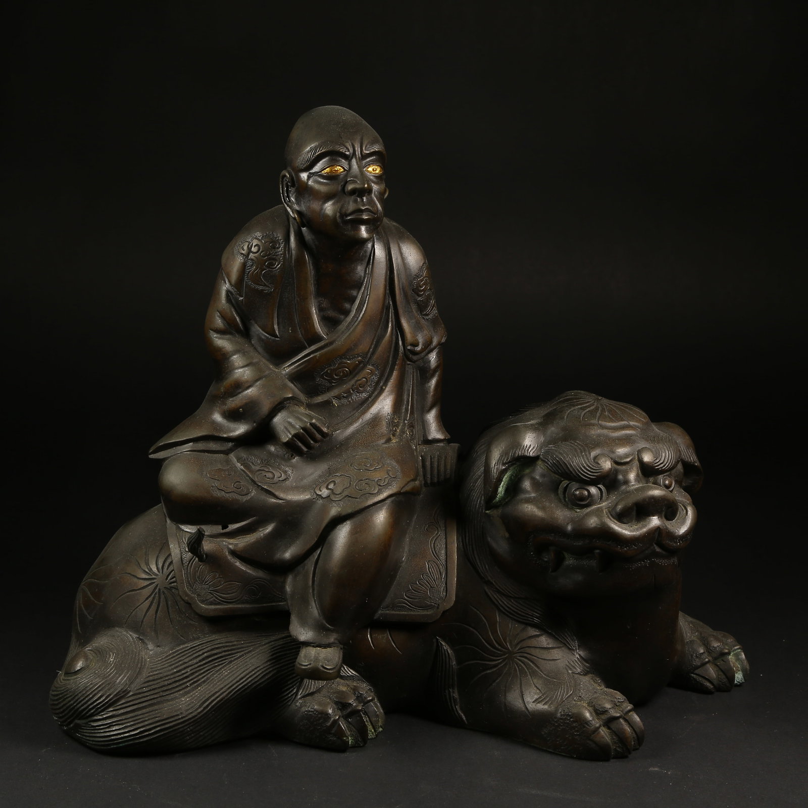 A BRONZE ARHAT STATUE (1 of 9)