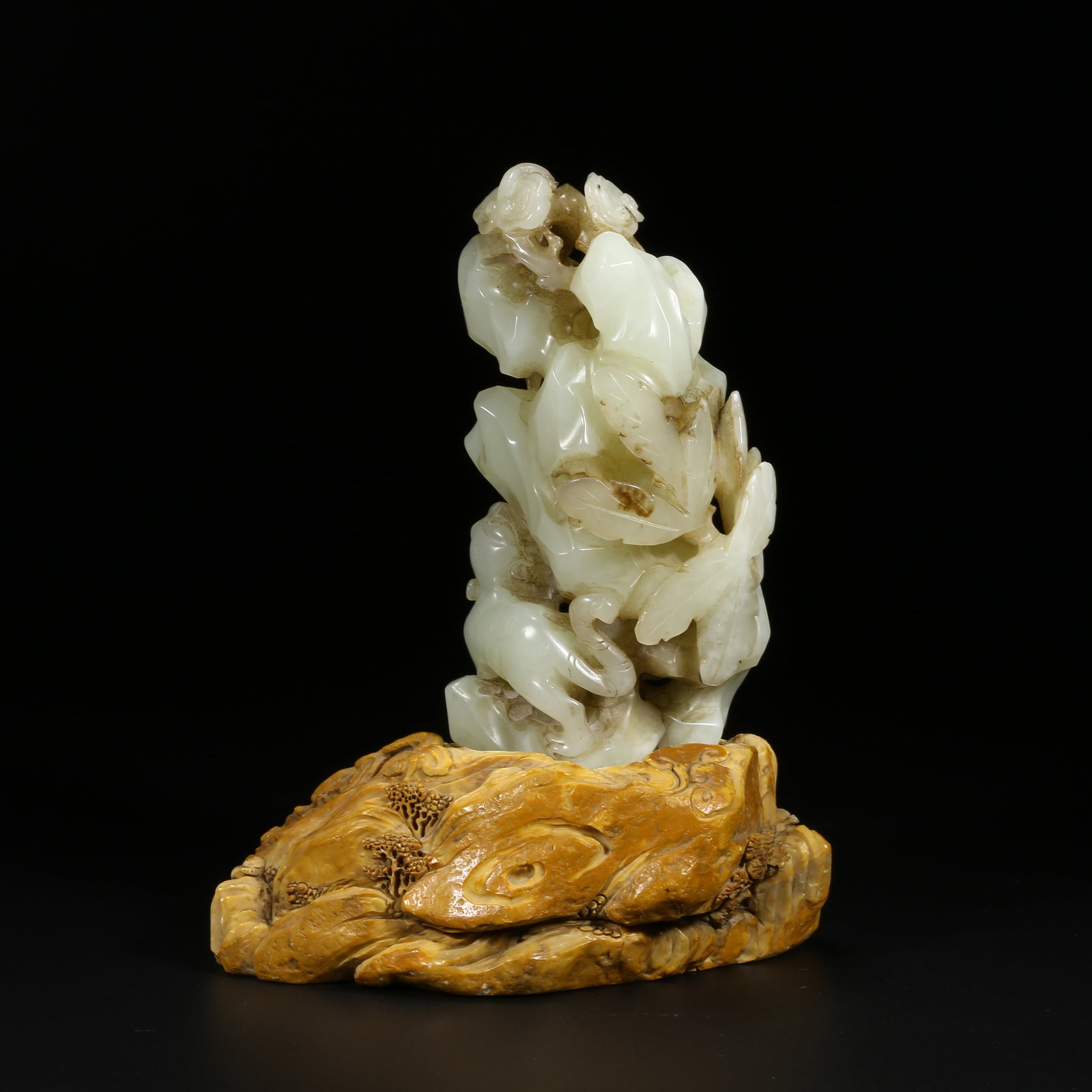 A HETIAN JADE AUSPICIOUS BEAST MOUNTAIN-FORM ORNAMENT (1 of 8)
