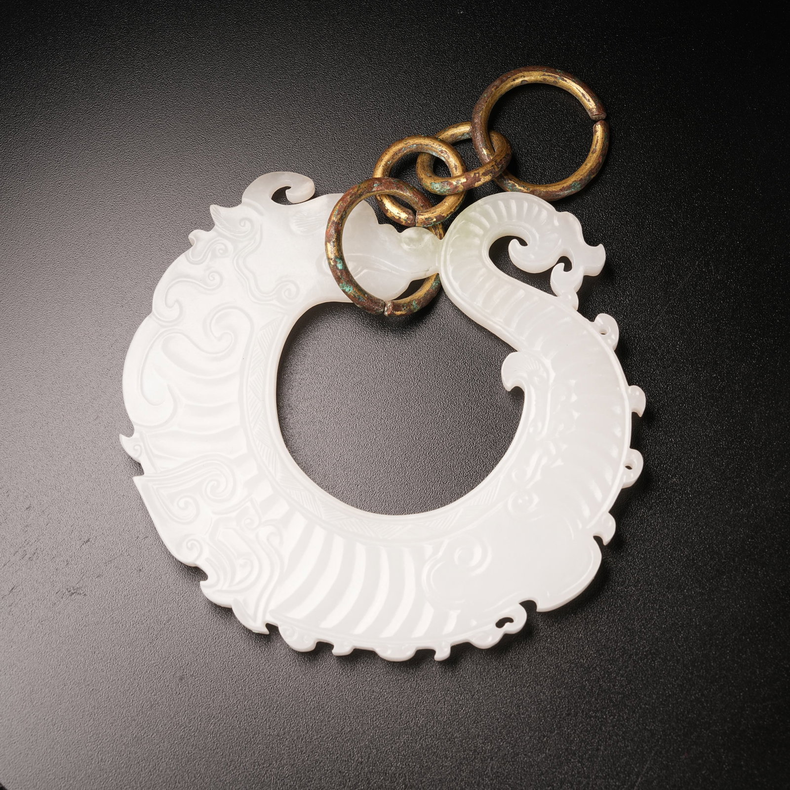 A HETIAN WHITE JADE OUROBOROS DRAGON PENDANT (1 of 9)