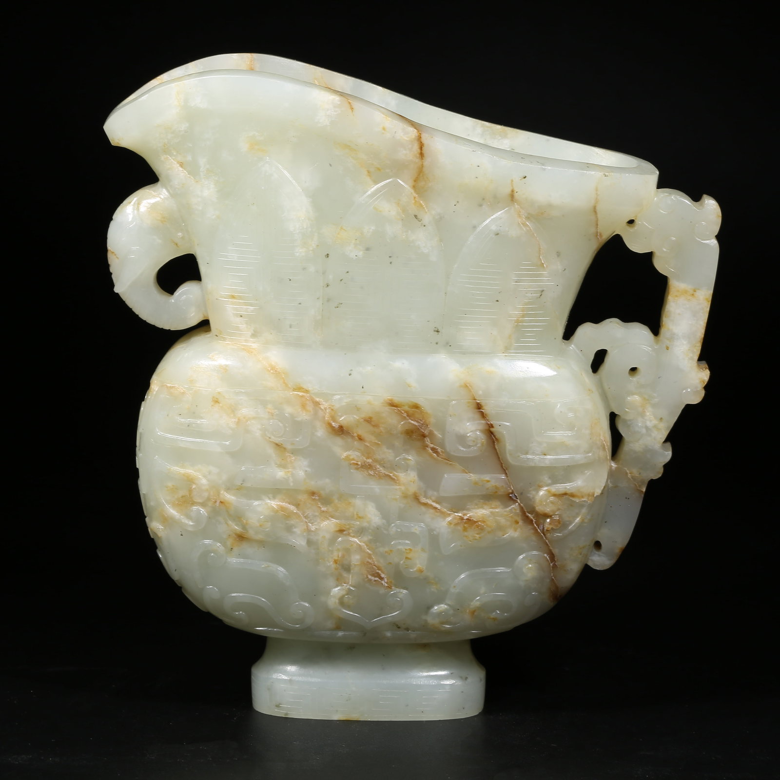 A HETIAN WHITE JADE WINE GOBLET WITH BEAST-FACE MOTIF (1 of 9)