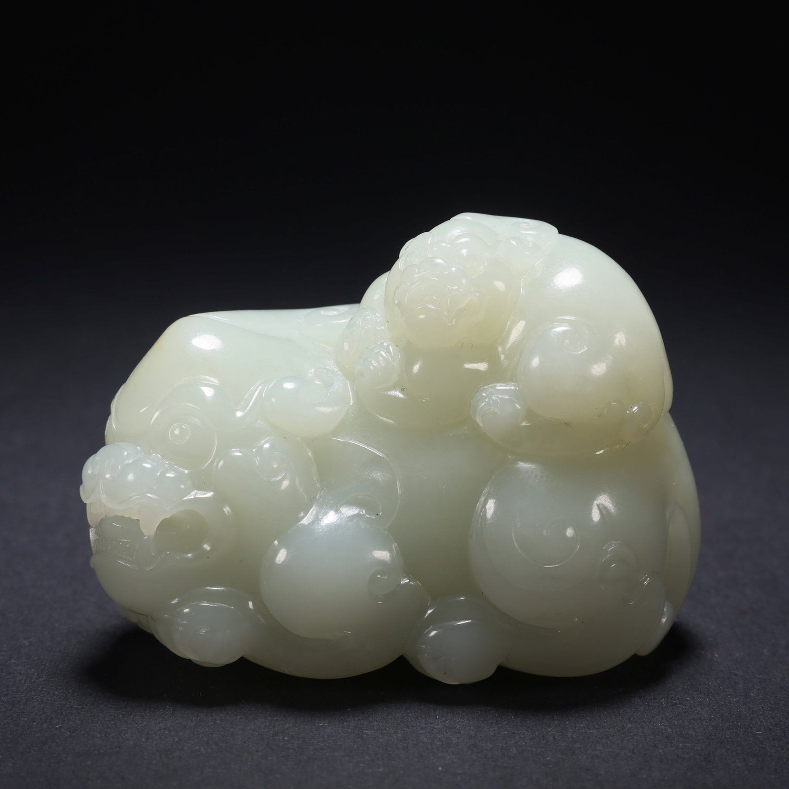 A HETIAN JADE MOTHER-AND-CHILD AUSPICIOUS BEAST (1 of 9)
