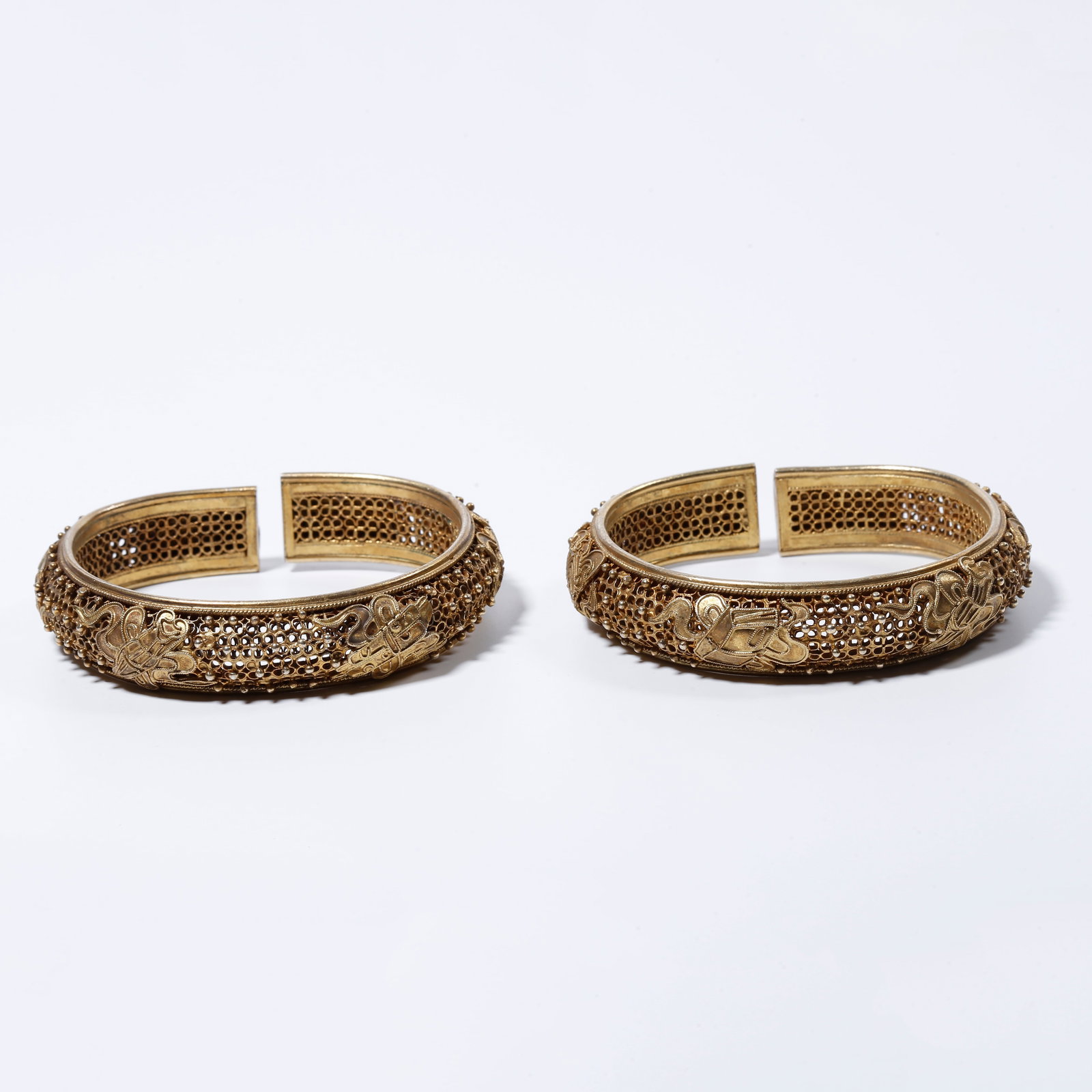 A SILVER PAIR OF EIGHT TREASURES PATTERNED BRACELETS (1 of 8)