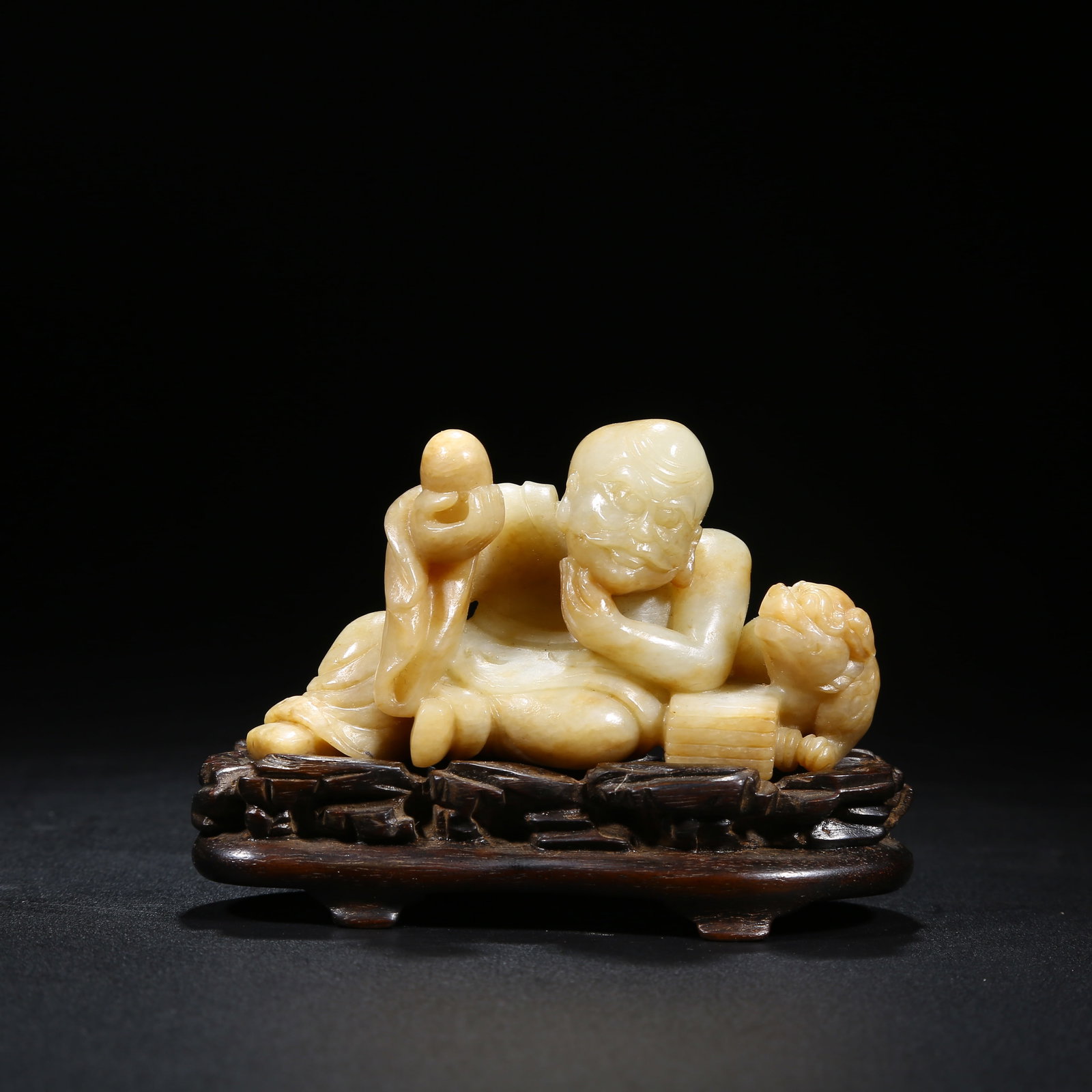 A HETIAN JADE ARHAT FIGURINE (1 of 8)