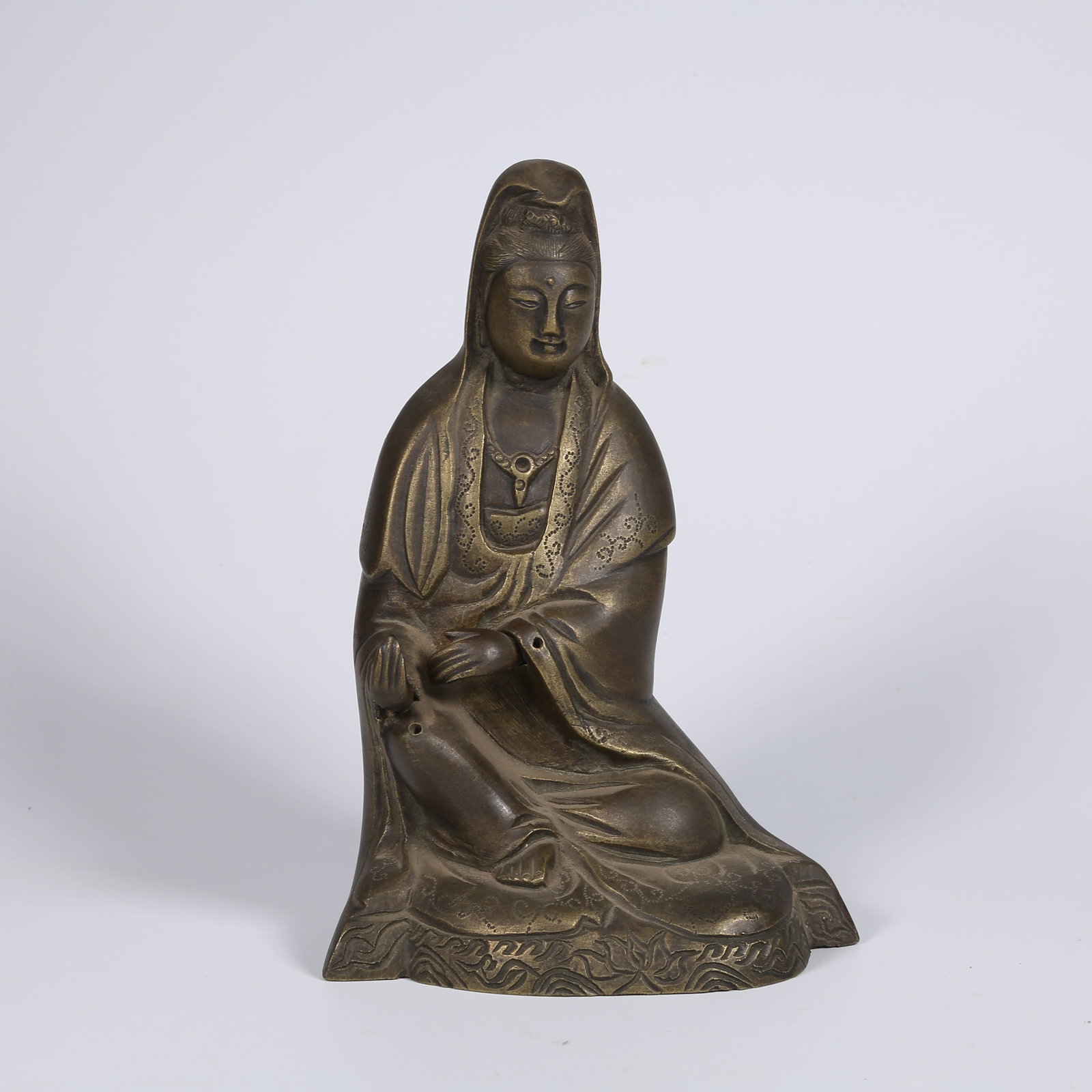 A BRONZE SEATED GUANYIN FIGURE (1 of 8)