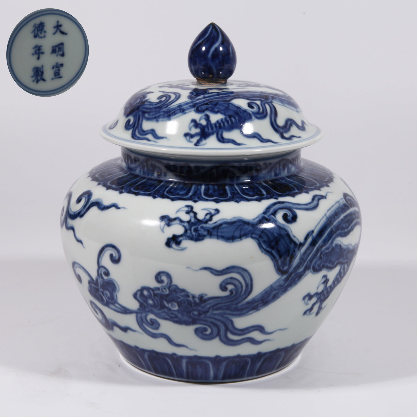 A COVERED JAR WITH CHI-DRAGON HOLDING BRANCH PATTERN IN UNDERGLAZE BLUE: Covered Jar with Chi-Dragon Holding Branch Pattern in Underglaze Blue