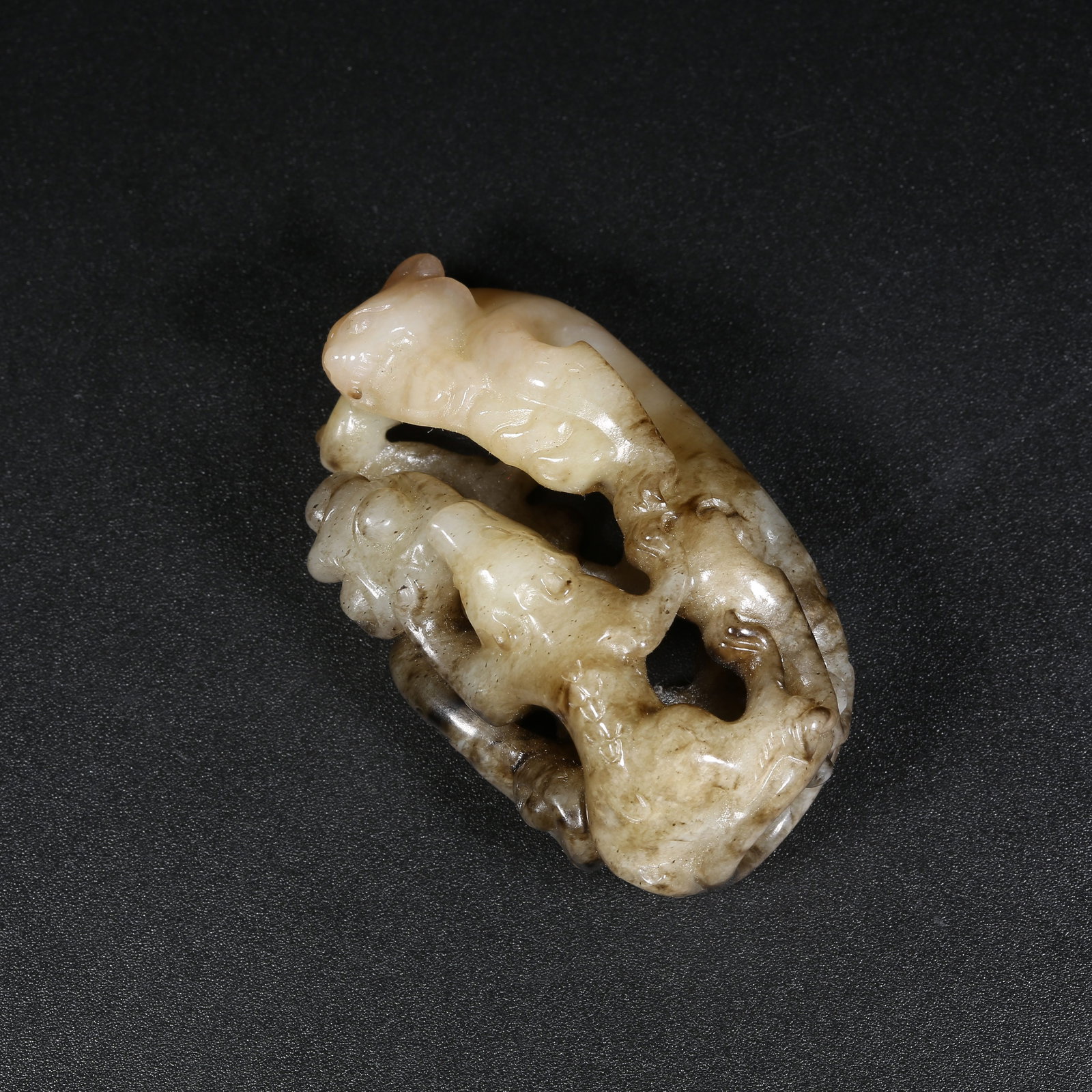 A MEDIEVAL JADE ZIMU-BEAST HANDHELD ORNAMENT (1 of 9)