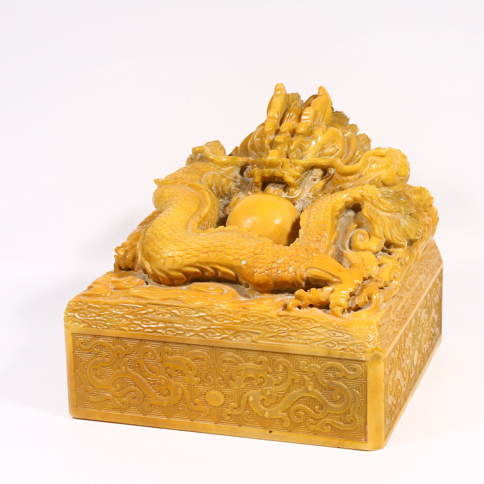 A SHOUSHAN STONE LARGE SEAL WITH DRAGON-SHAPED KNOB: Shoushan stone large seal with dragon-shaped knob