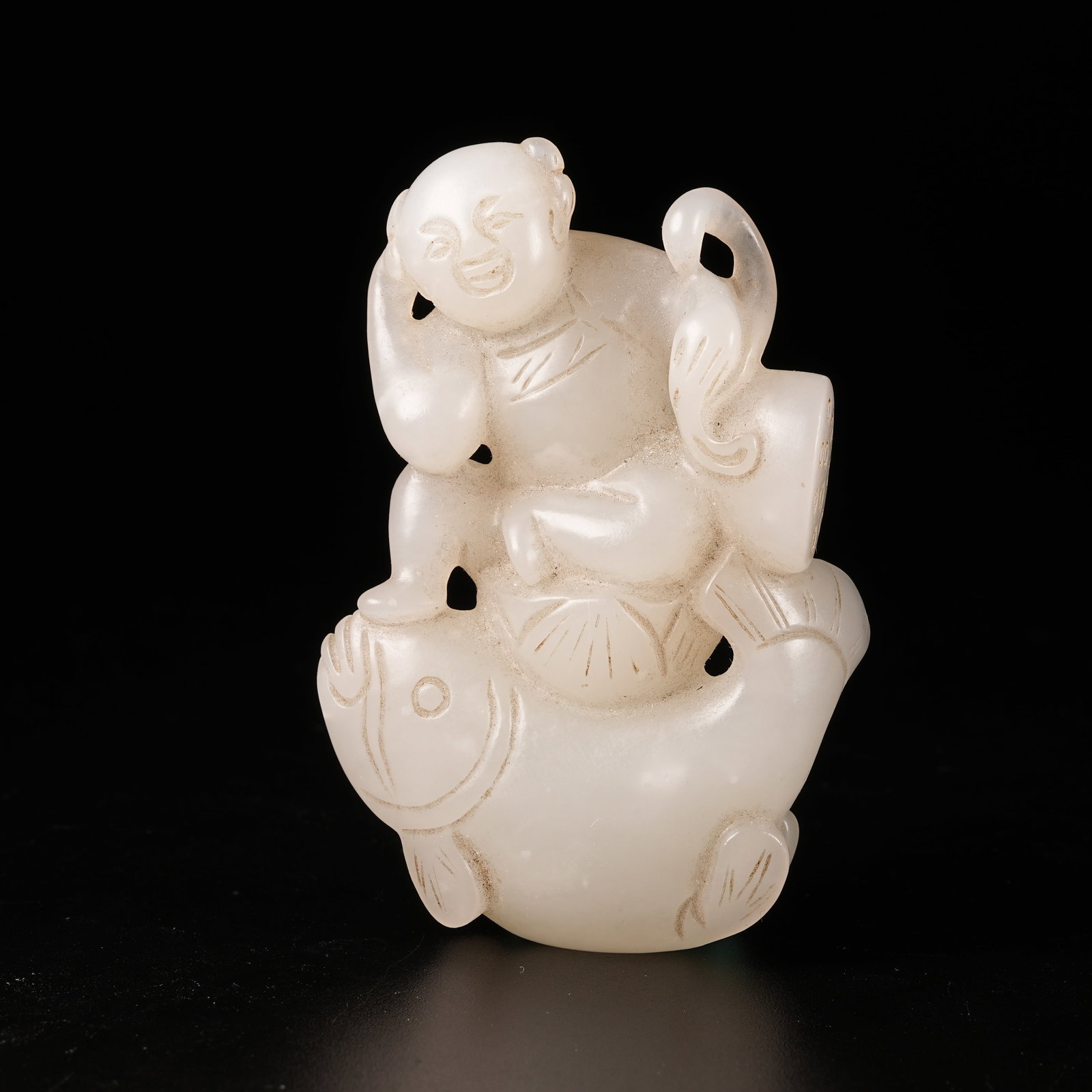 A HETIAN JADE PLAYING-FISH BOY ORNAMENT (1 of 8)