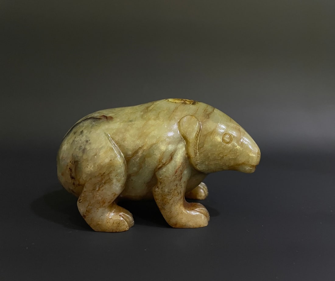 A HAN-DYNASTY HETIAN JADE BEAR (1 of 8)