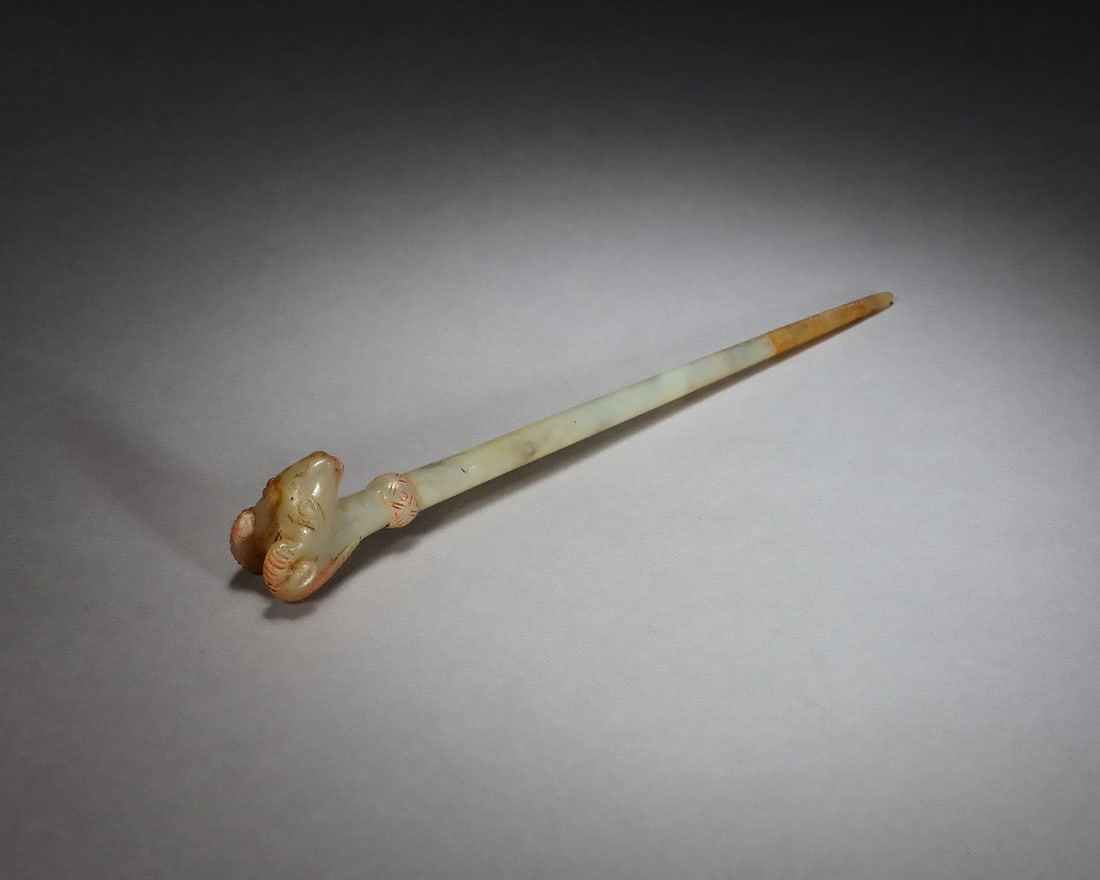 A HETIAN JADE HAIRPIN WITH RAM'S-HEAD FINIAL (1 of 7)