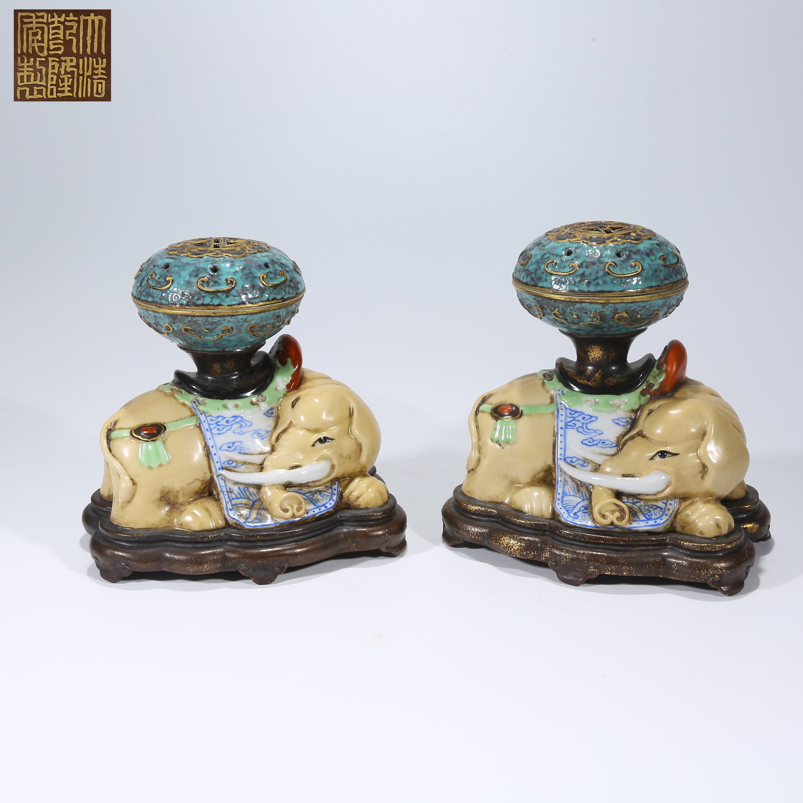 A FAMILLE ROSE ELEPHANT-SHAPED PORCELAIN SET OF PEACEFUL ELEPHANT INCENSE BURNERS: Famille Rose Elephant-Shaped Porcelain Set of Peaceful Elephant Incense Burners