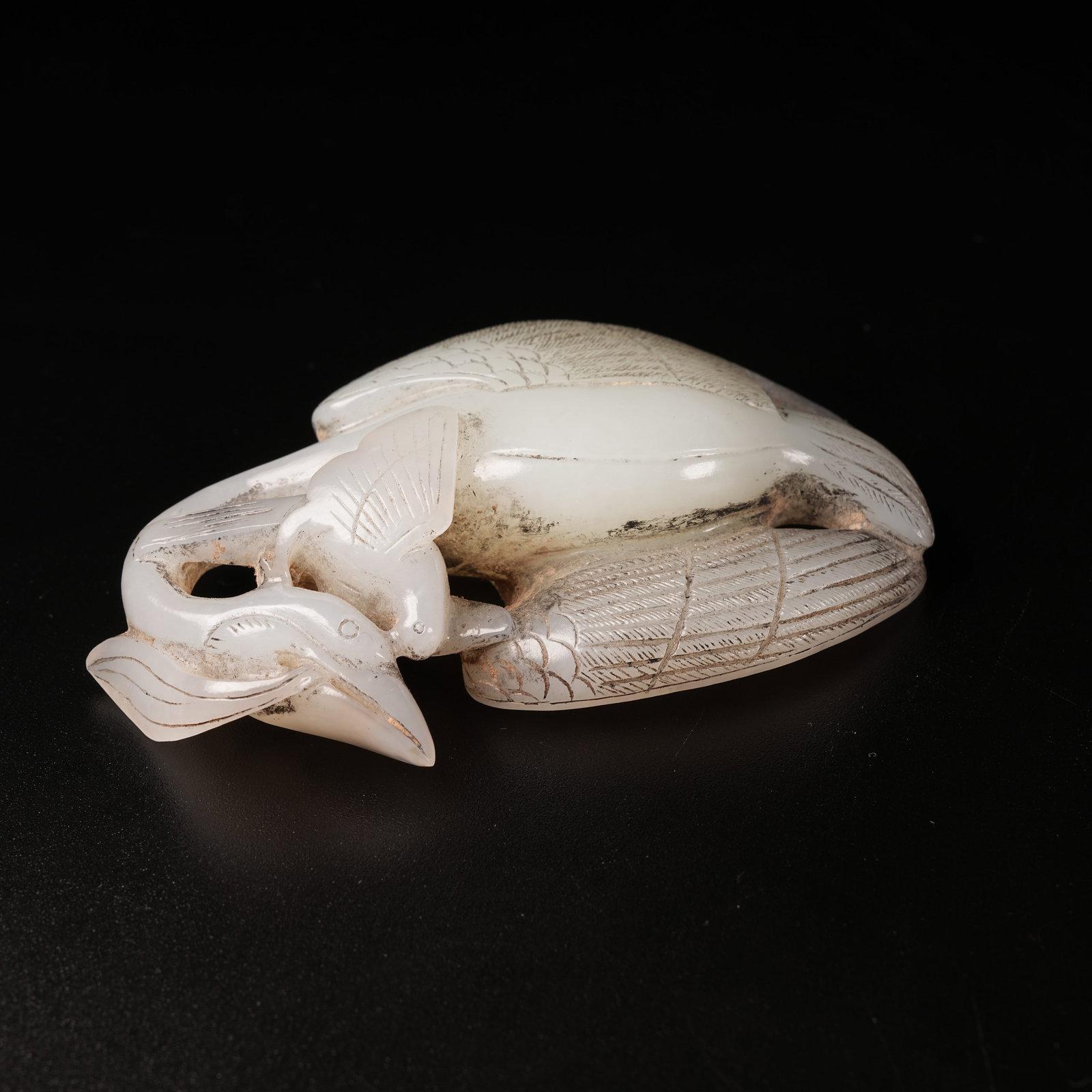 A ANCIENT JADE SEA-EAGLE PECKING GOOSE ORNAMENT: Ancient Jade Sea-Eagle Pecking Goose Ornament