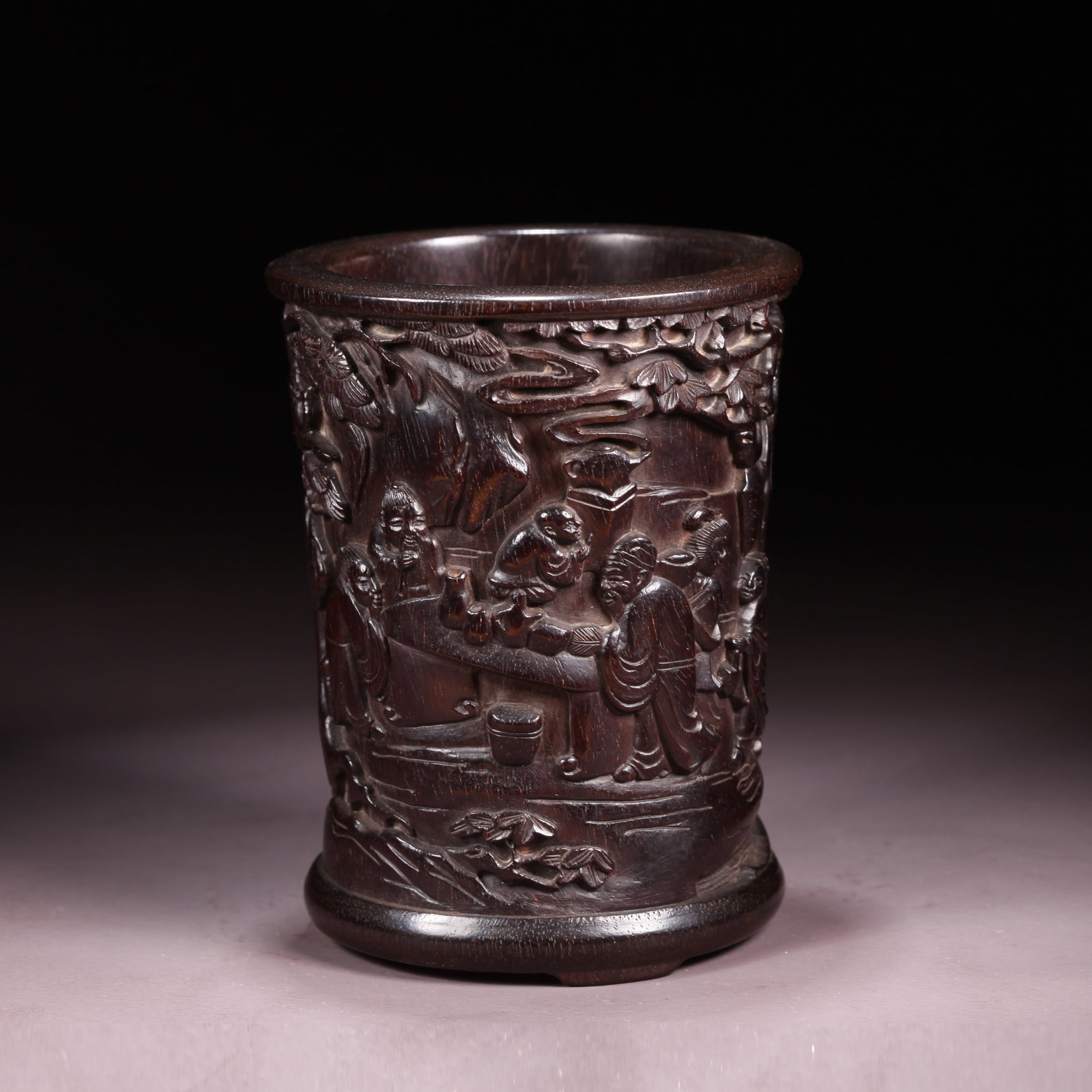 A ZITAN BRUSH POT WITH ELEGANT GATHERING SCENE: Zitan Brush Pot with Elegant Gathering Scene
