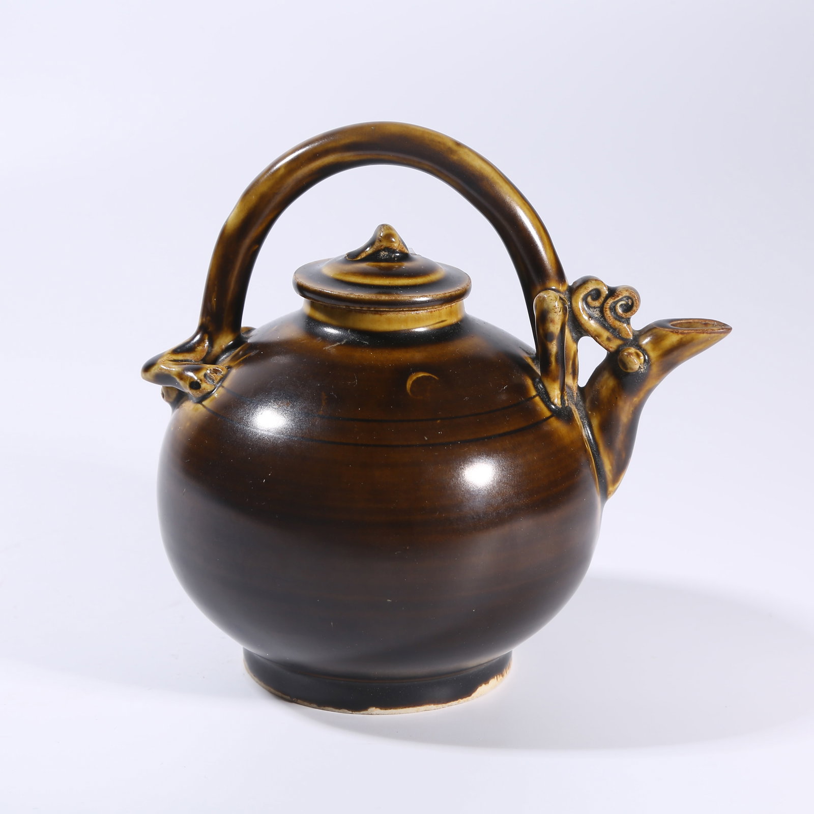 A BROWN-GLAZED HANDLED EWER (1 of 9)