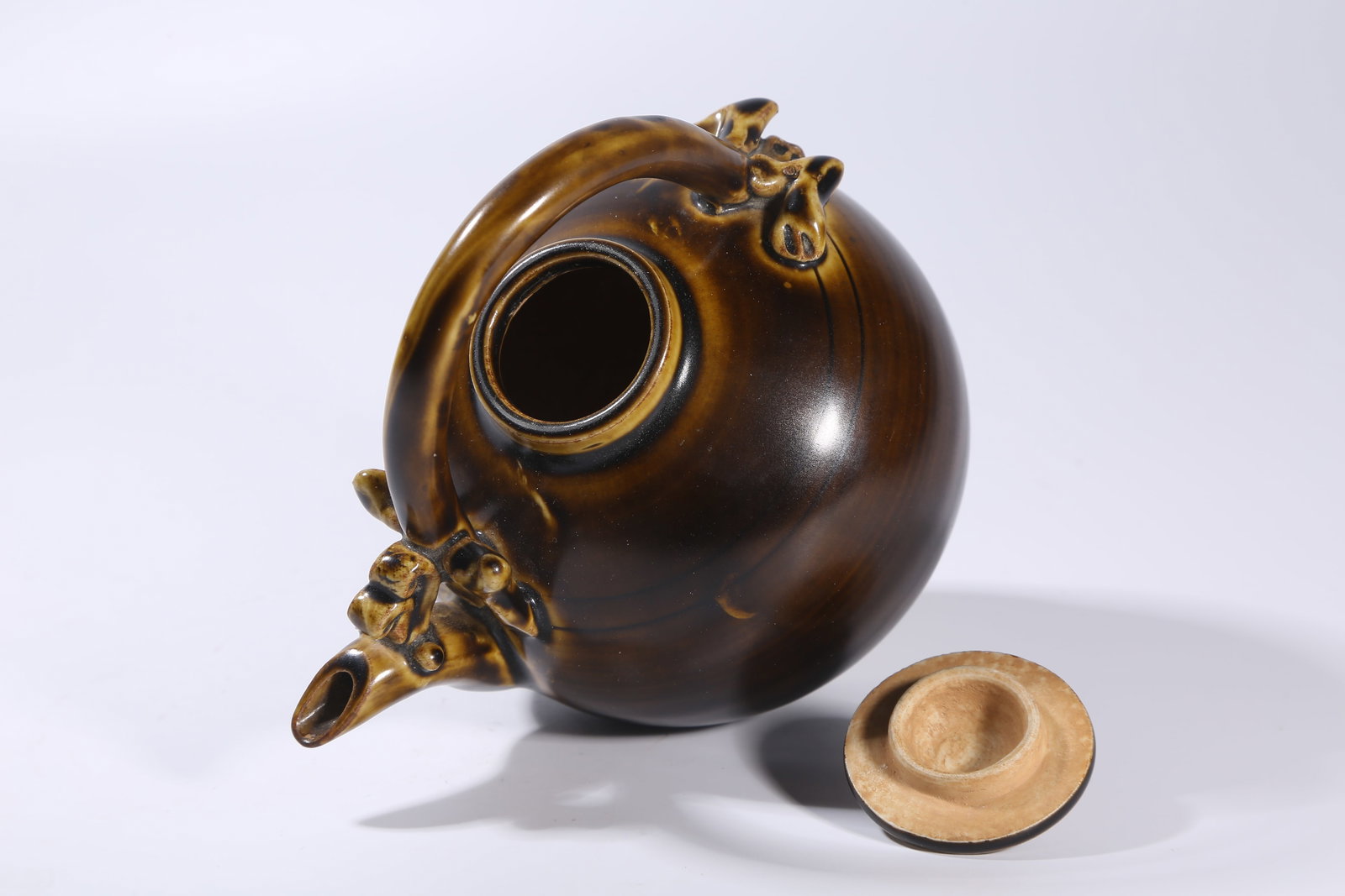 A BROWN-GLAZED HANDLED EWER - 8
