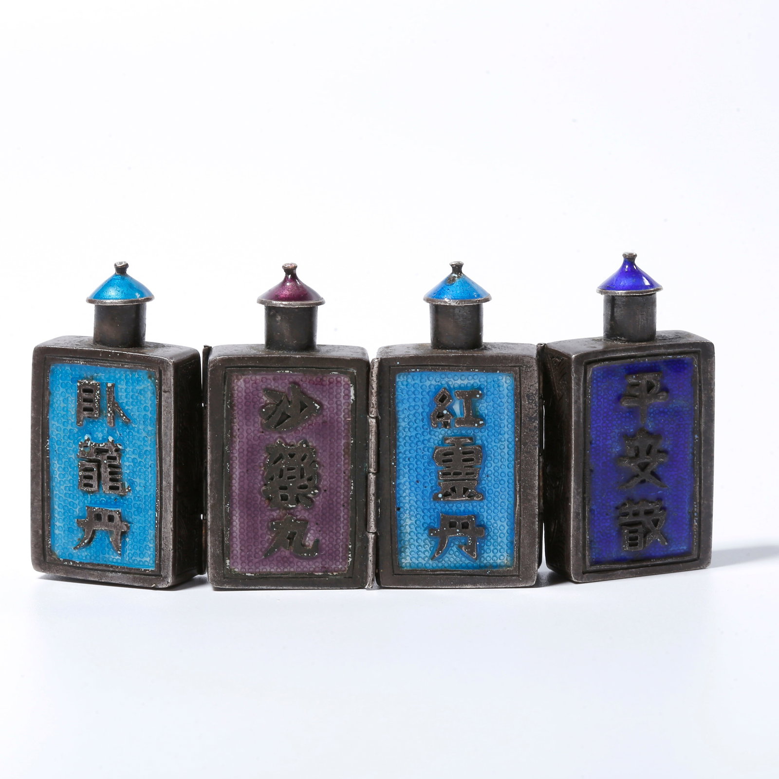 A SILVER FLORAL PATTERNED FOUR-COMPARTMENT SNUFF BOTTLE (1 of 10)