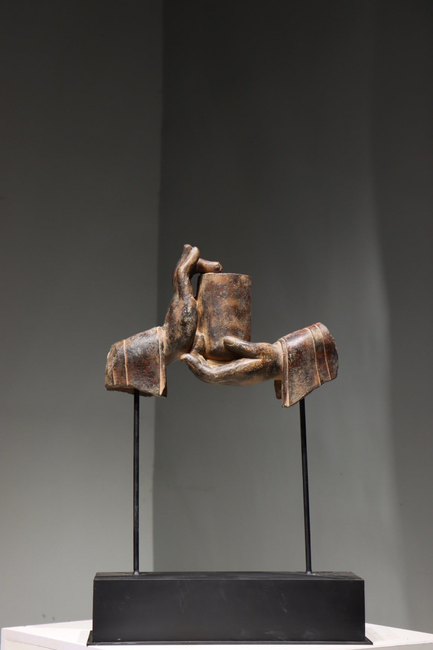 A BLACK BLUESTONE BUDDHA HAND (1 of 7)