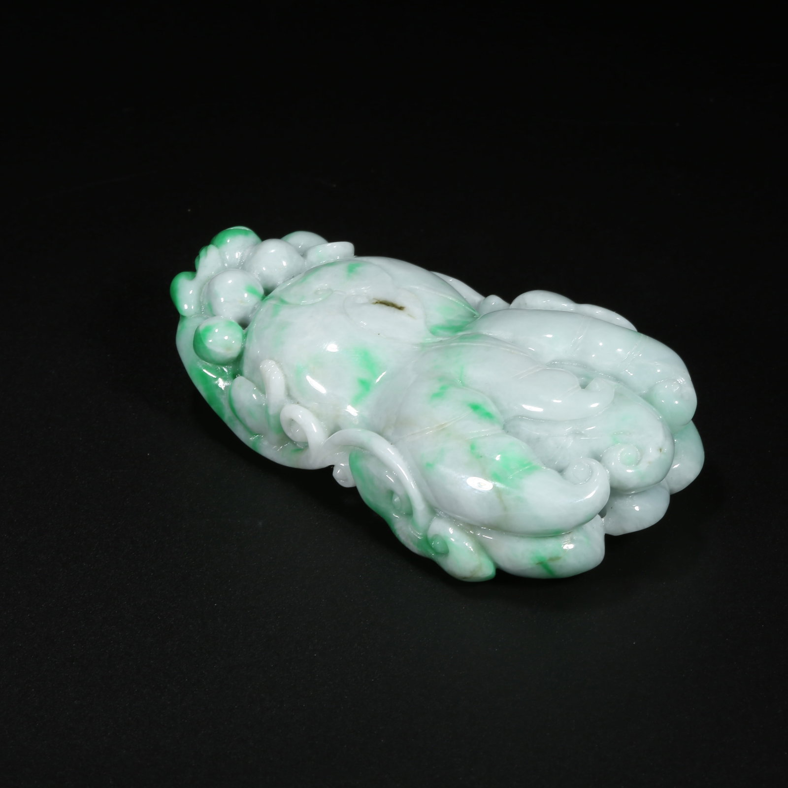 A JADEITE BUDDHA'S HAND PENDANT: Jadeite Buddha's Hand Pendant